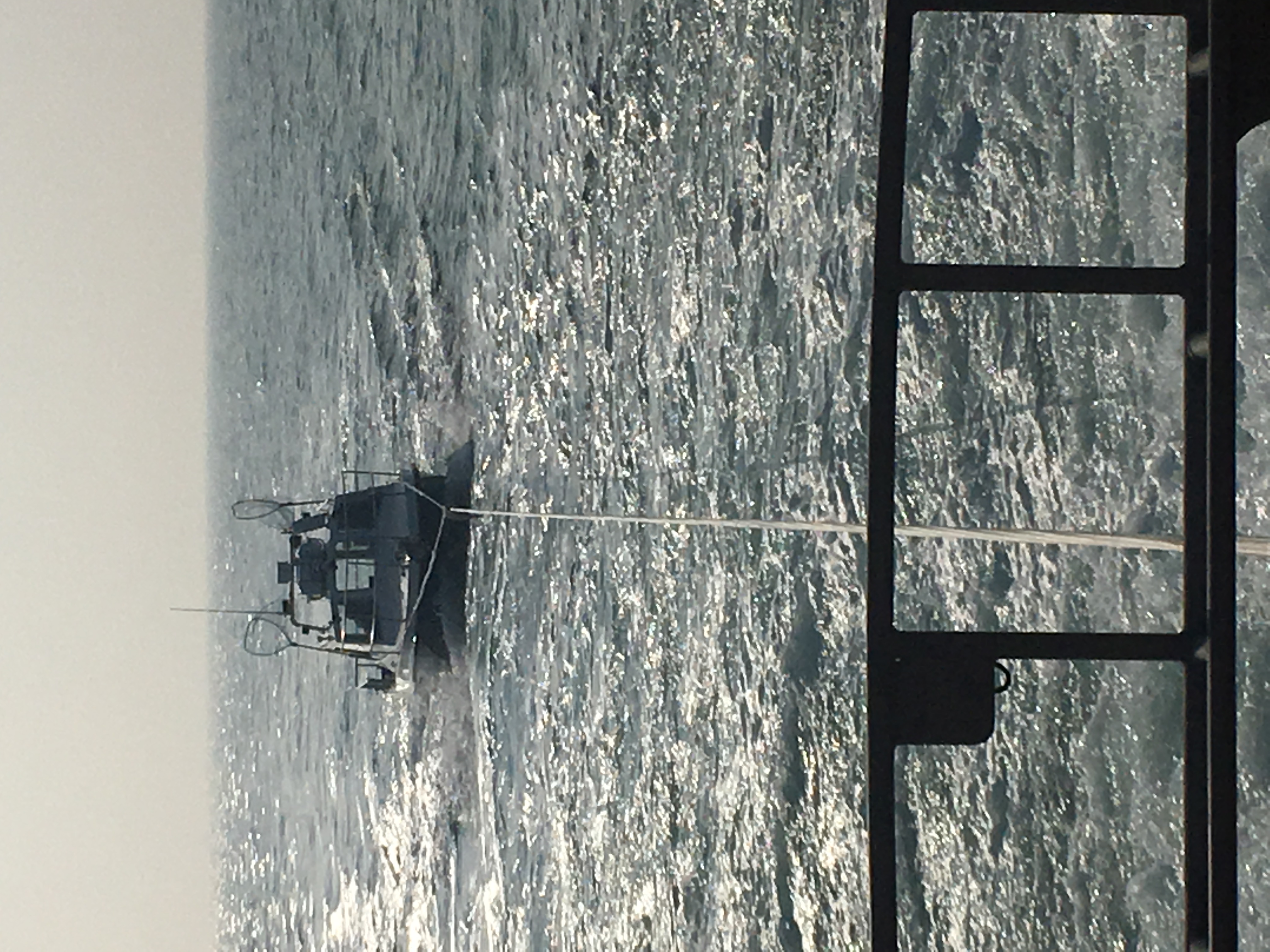 Angling boat under tow by ALB