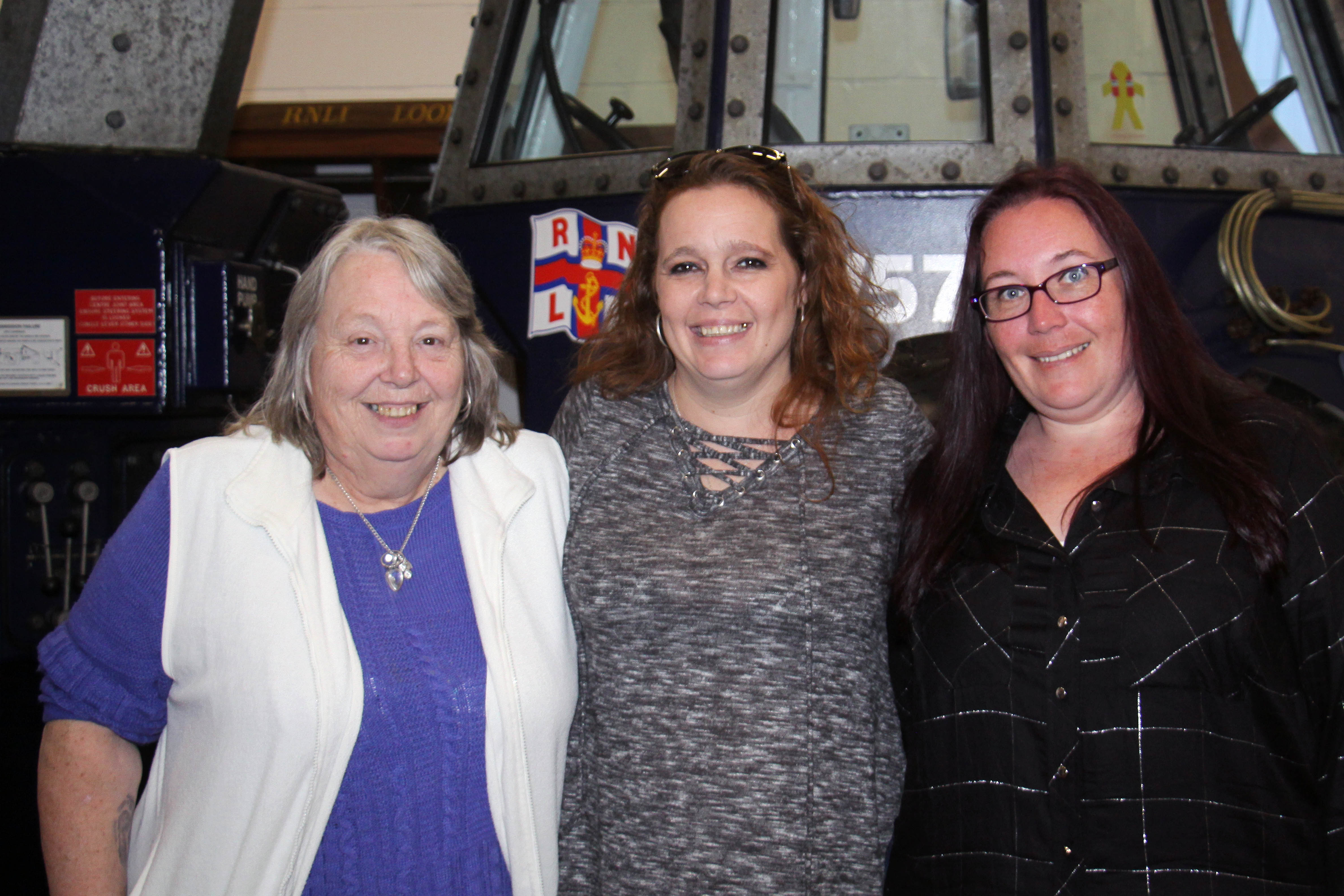 The winning darts team, Sue Marsh, Kate Marsh and Abbi Bradbury at Looe Lifeboat Station