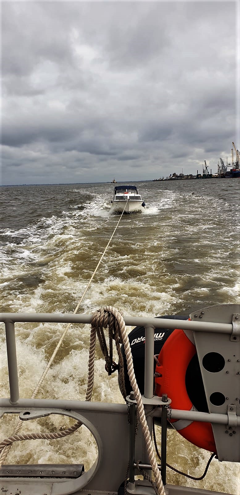 The small craft involved in the second incident being towed to safety after drifting under a jetty