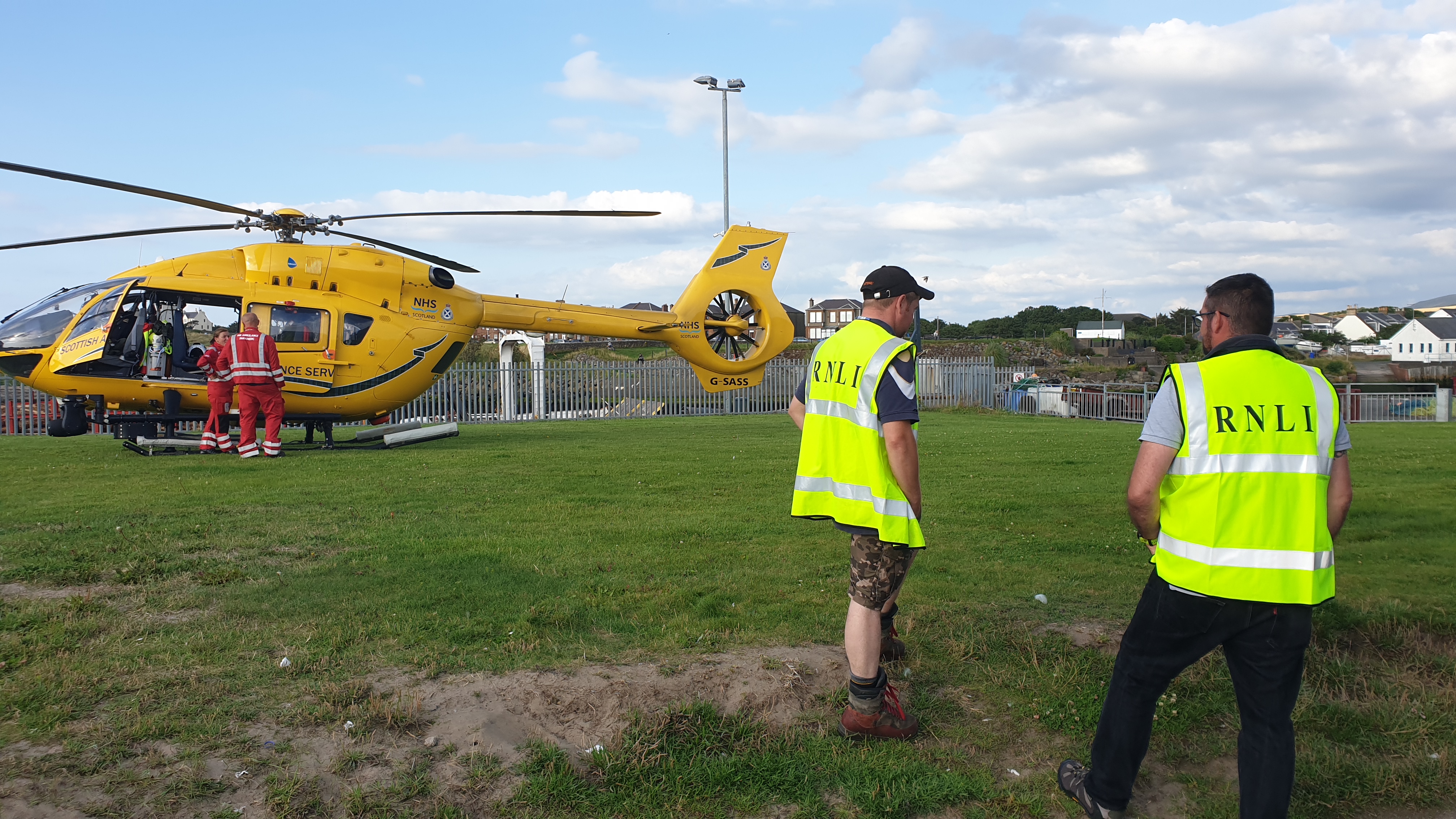Girvan Lifeboat Crew assisting Scottish Air Ambulance, making landing site safe from the public.