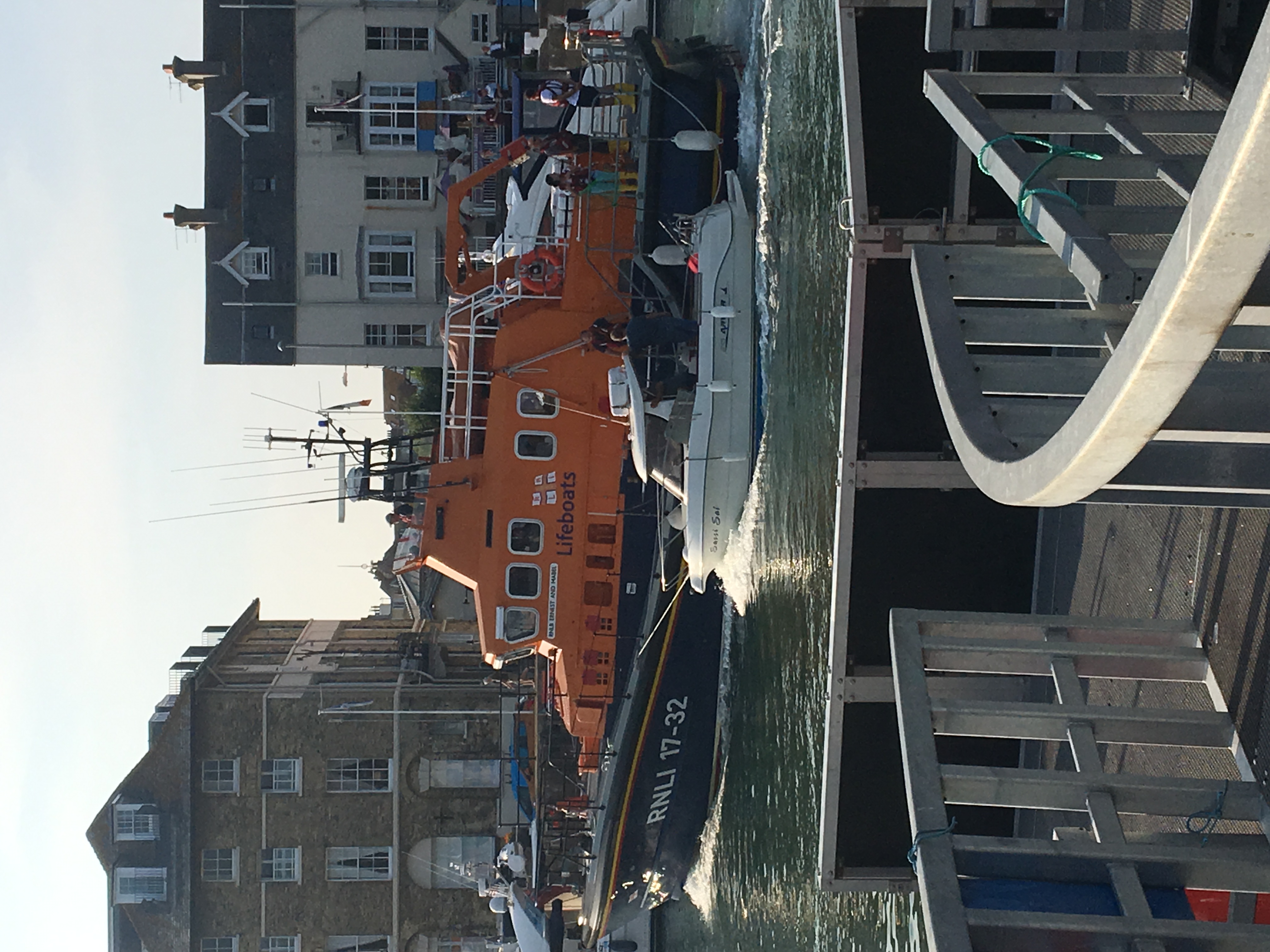 The motor boat being brought into Weymouth harbour