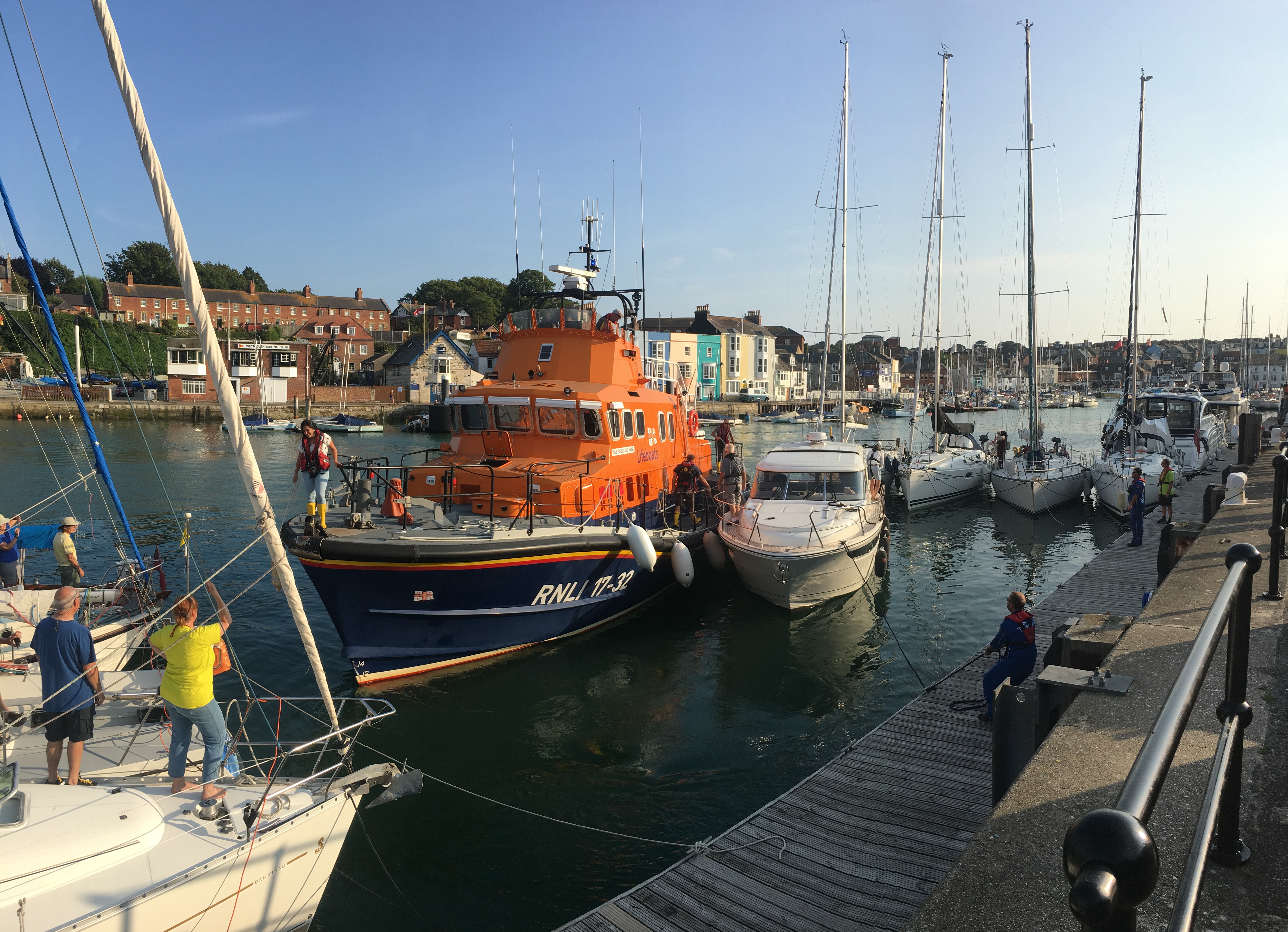 The cabin cruiser being berthed in Weymouth Harbour