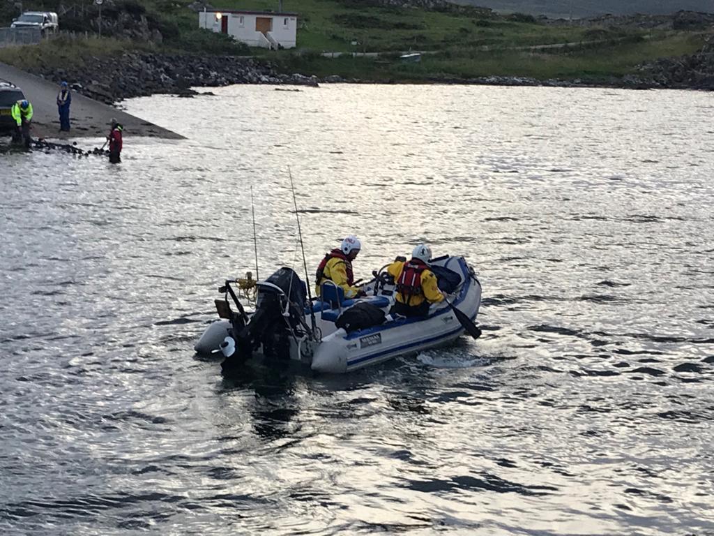 Tobermory crew members row the RIB ashore at Kilchoan Pier