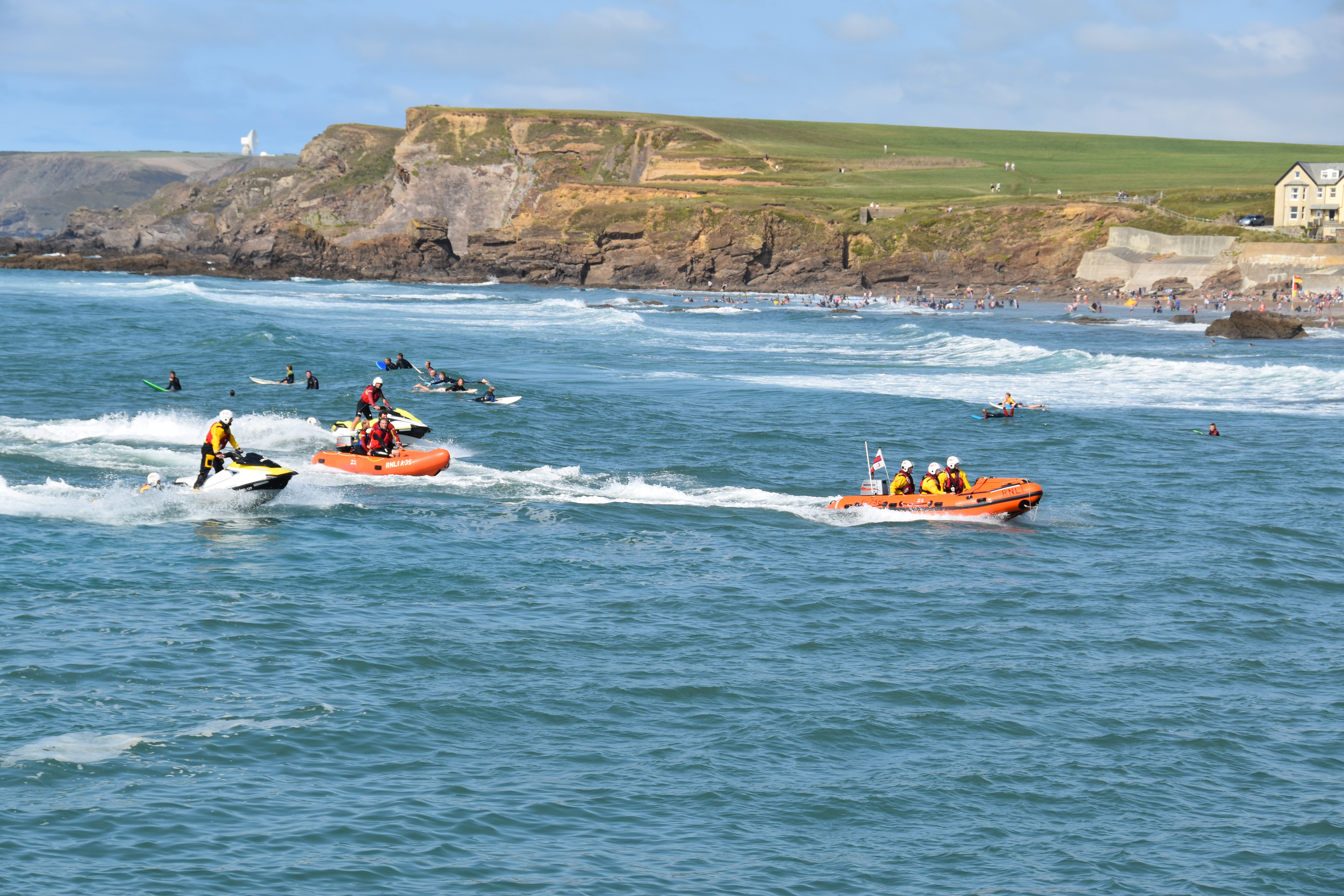 The Bude volunteer lifeboat crew and RNLI lifeguards with RNLI D class lifeboat, two Rescue Water Crafts and an Inshore Rescue Craft