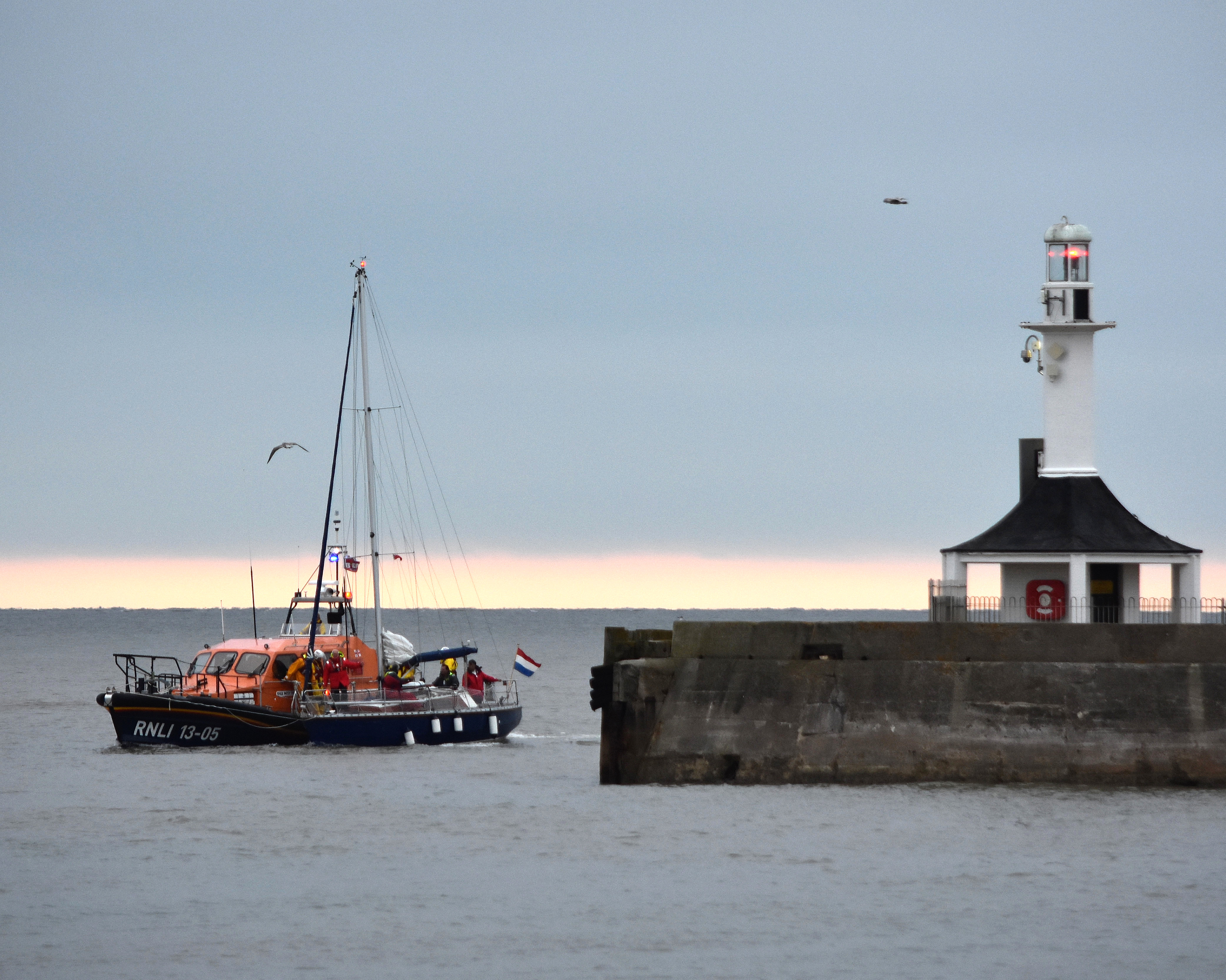 Lowestoft RNLI LIfeboat 'Patsy Knight' brings the Dutch yacht without a rudder into port just after daybreak