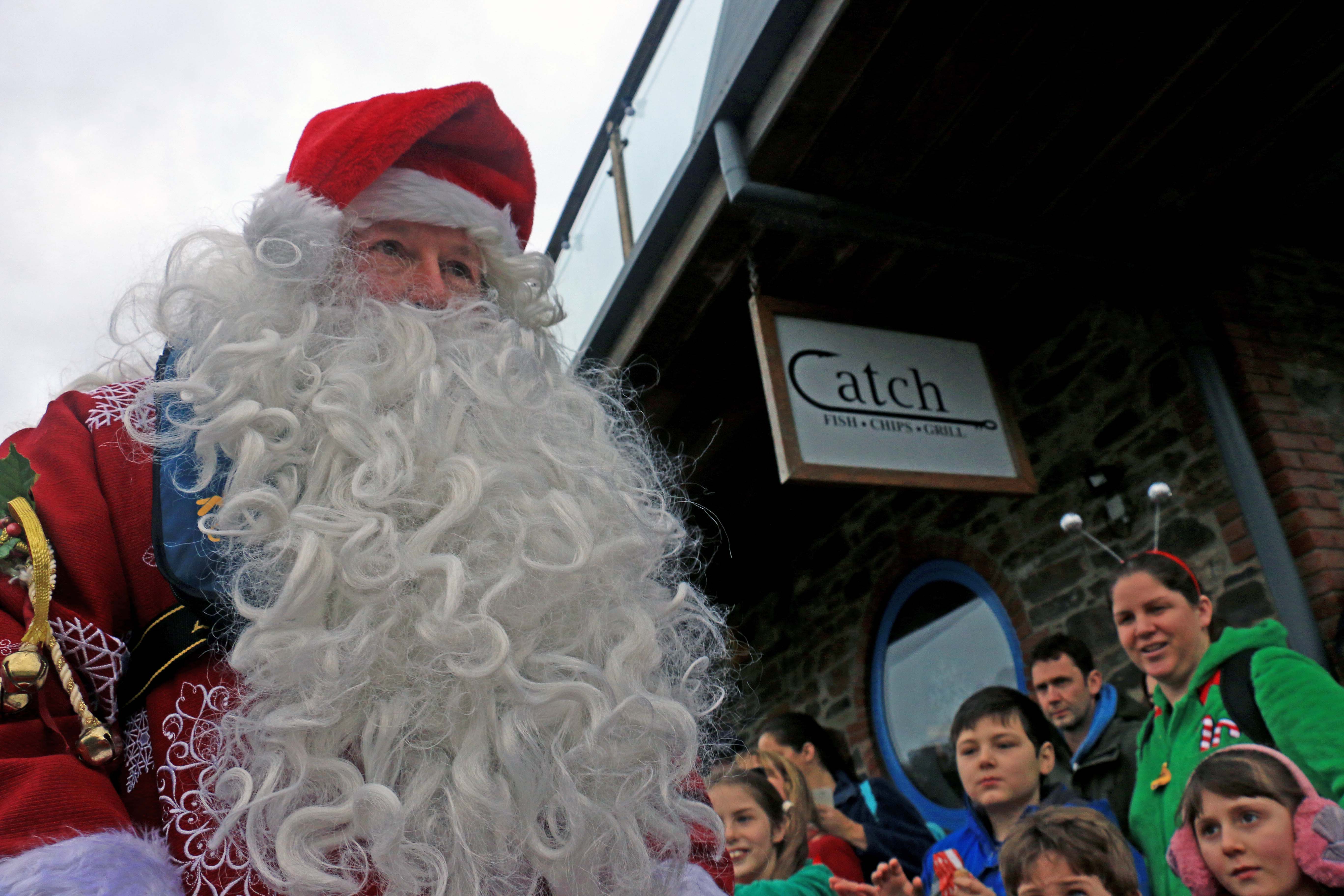 Santa arriving at the ferry steps, East Looe Quay 