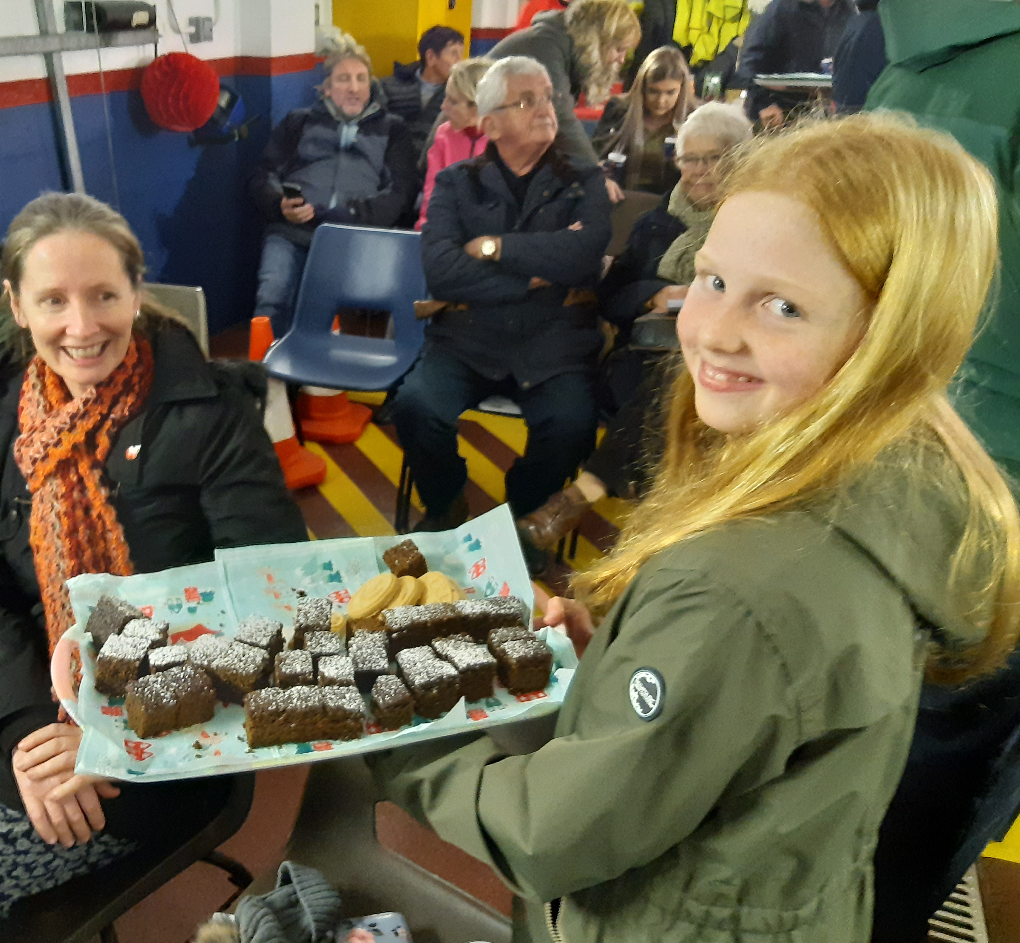 One of the pupils handing out the ginger bread