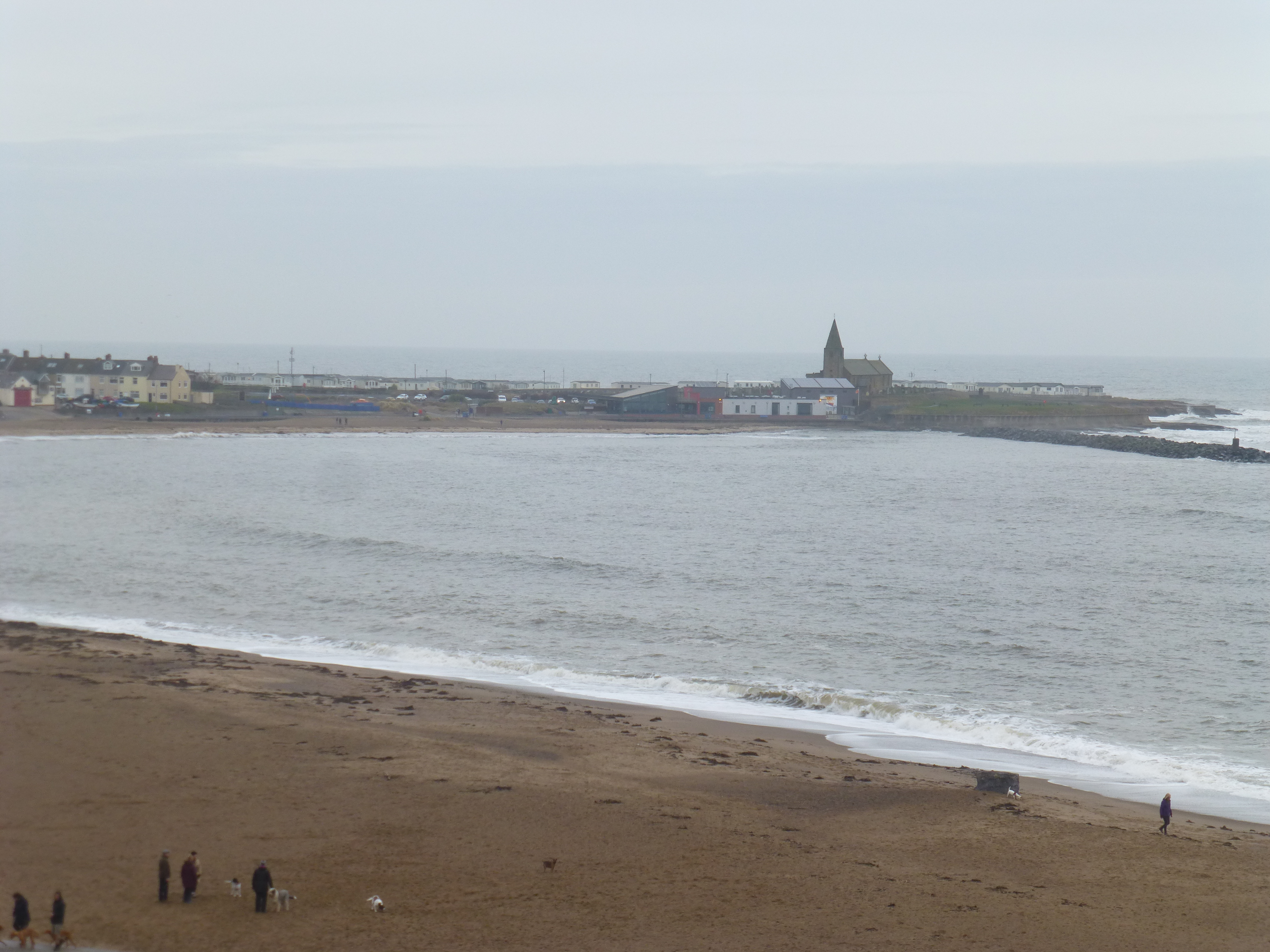 Photograph showing the north bay with the lifeboat station and the breakwater