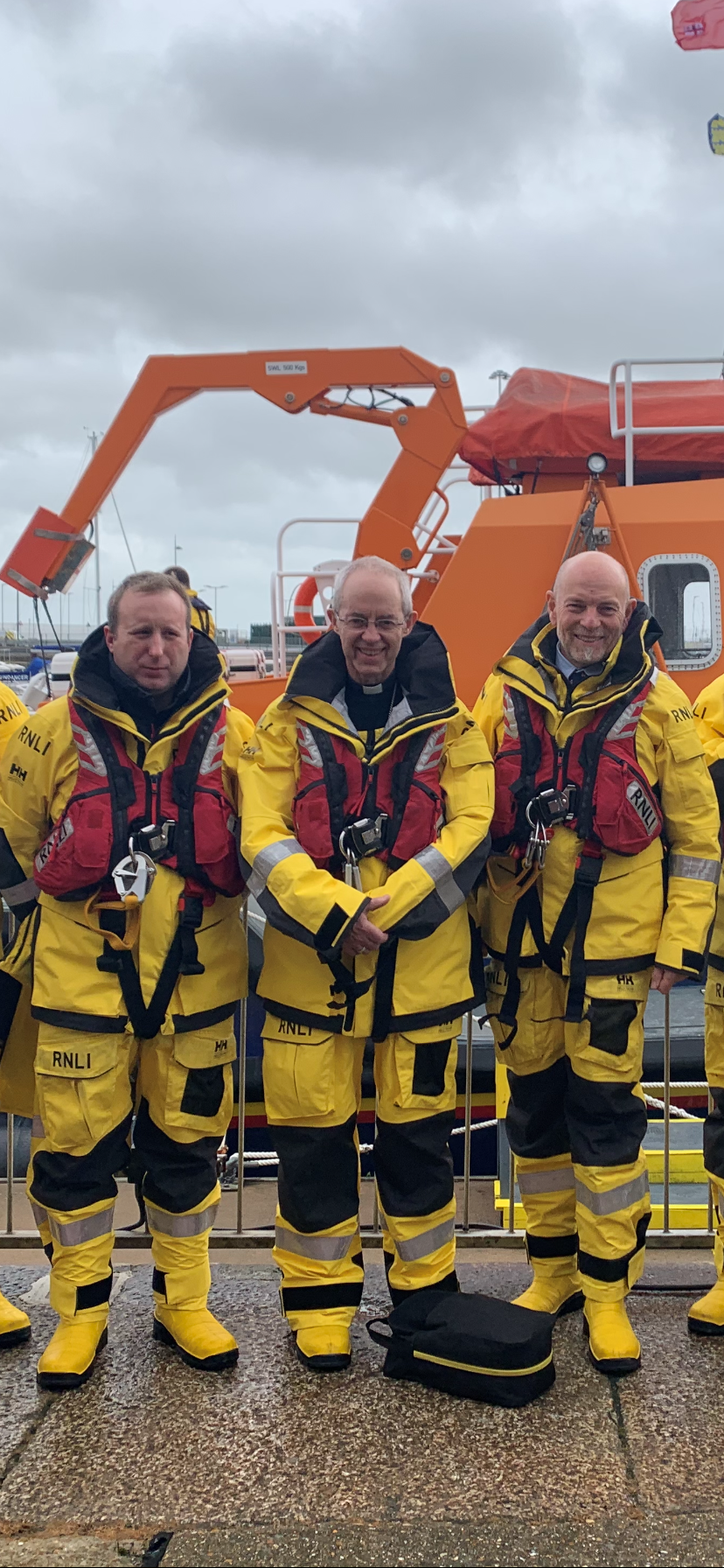 Archbishop Justin Welby with James Clapham and Jon Miell, Coxwains of the RNLI Dover lifeboat.
