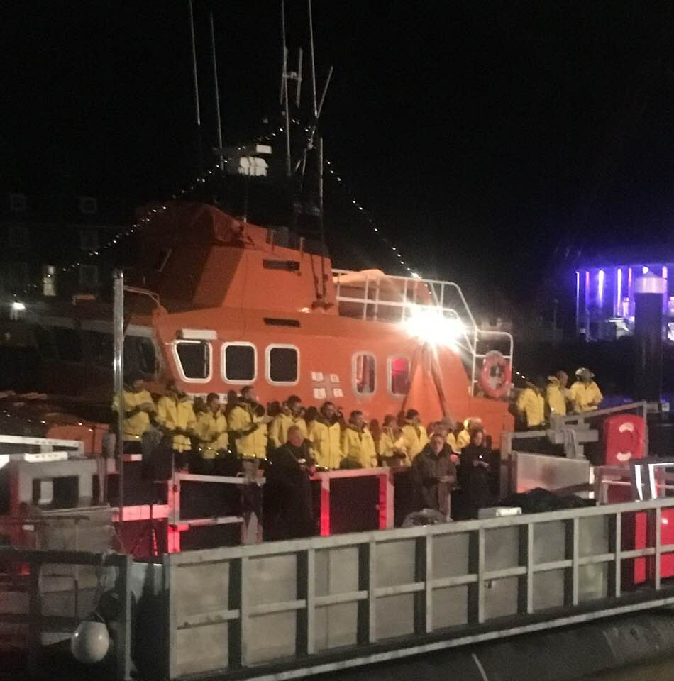The crew line the decks of Ernest and Mabel