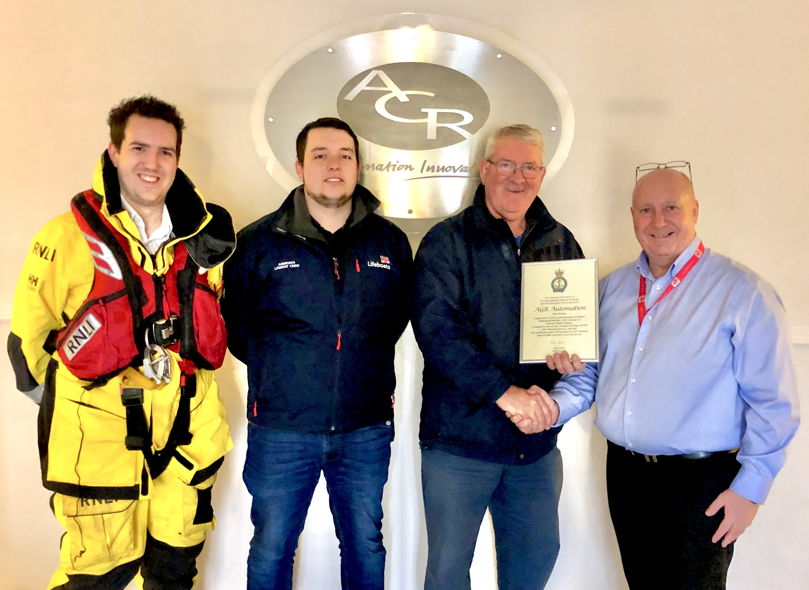 Craig Dickson of AGR Automation being presented with the certificate of appreciation from Alex Smith, Michael Marr and Sam Clow of Arbroath RNLI.