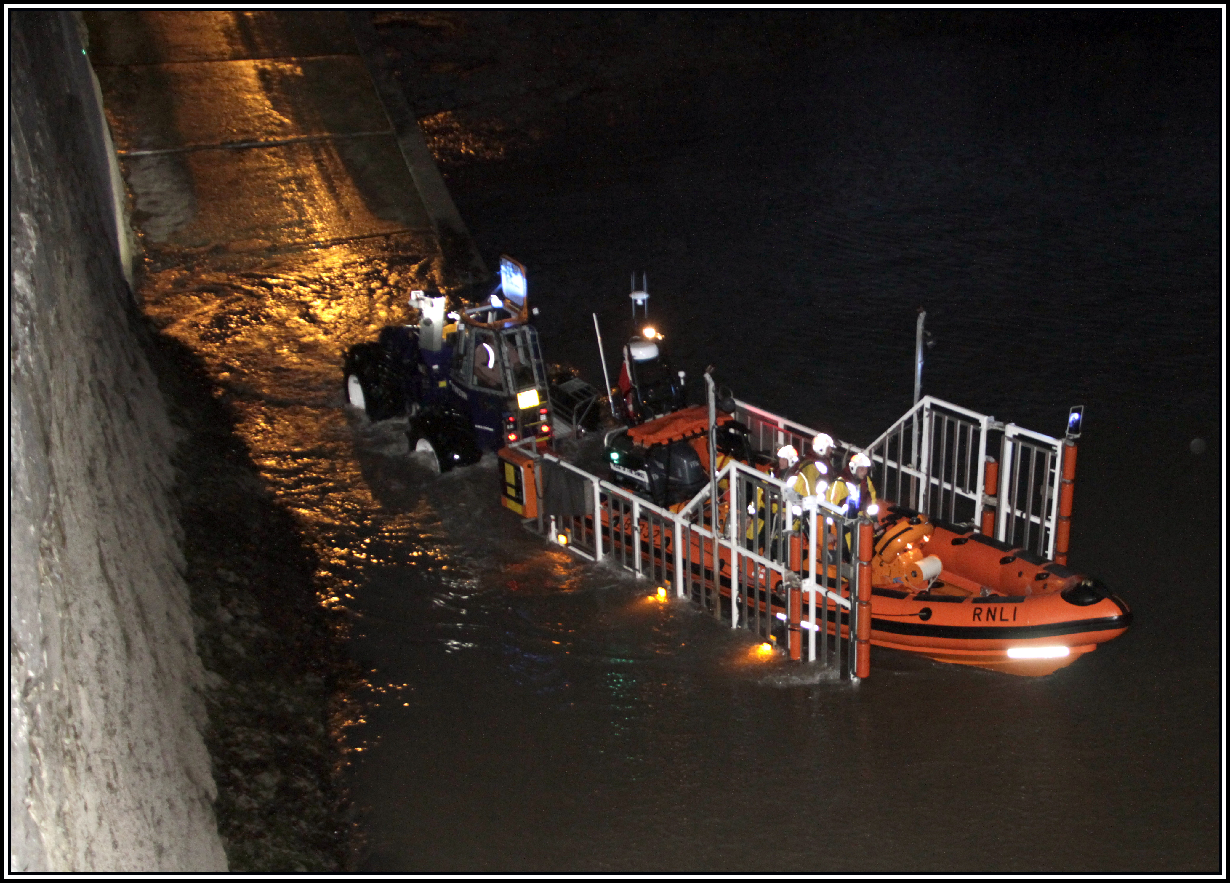 Lifeboat being taken down slipway and about to launch