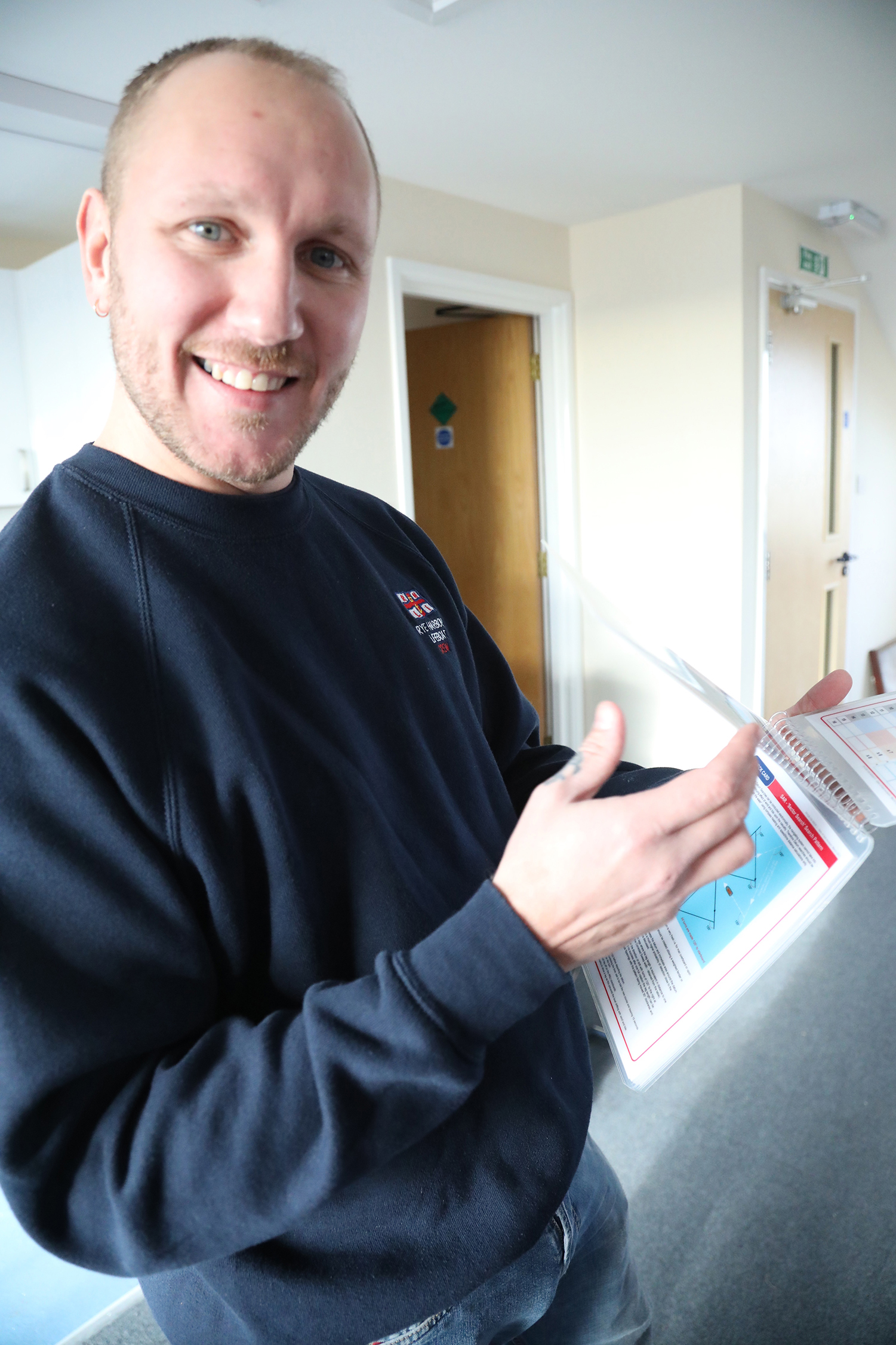 Luke a member of the team using cards to revise