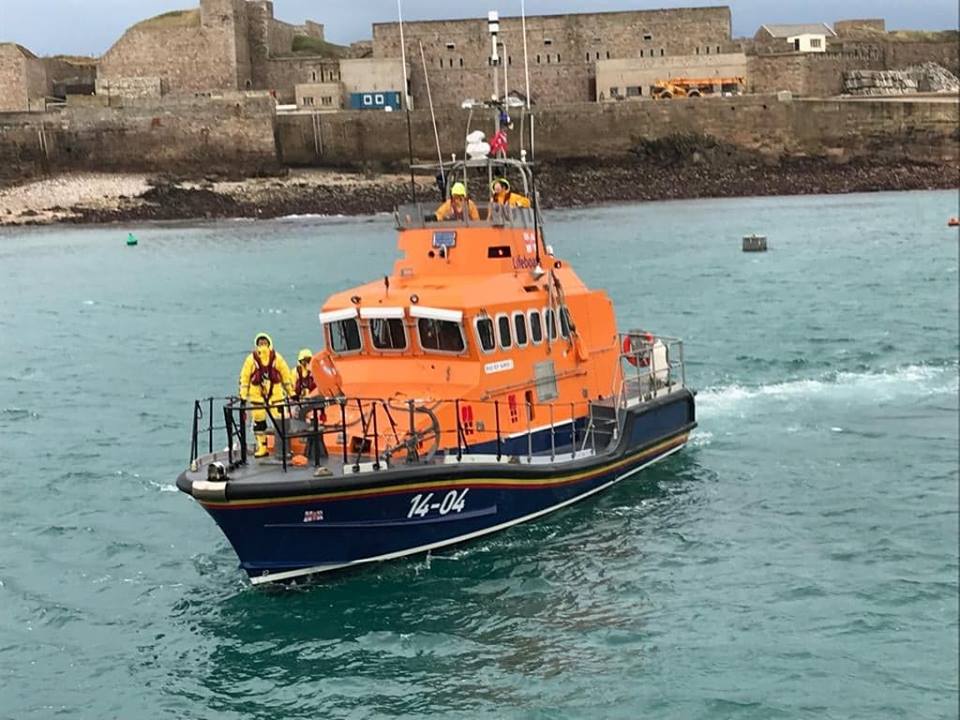 The Alderney Lifeboat returns to the island for a crew change before resuming the search.