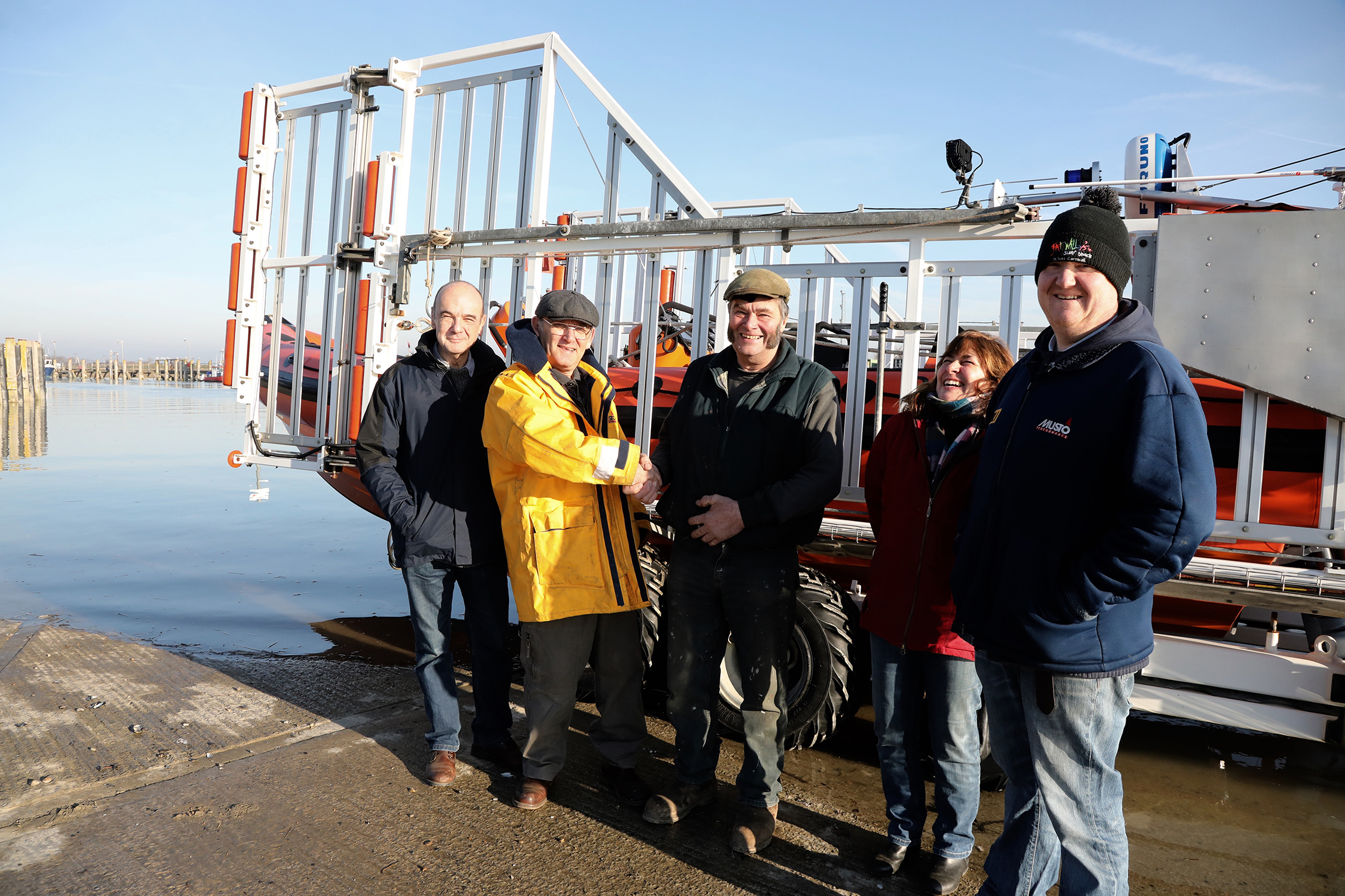 donation of money being passed over in front of the boat at Rye Habrbour