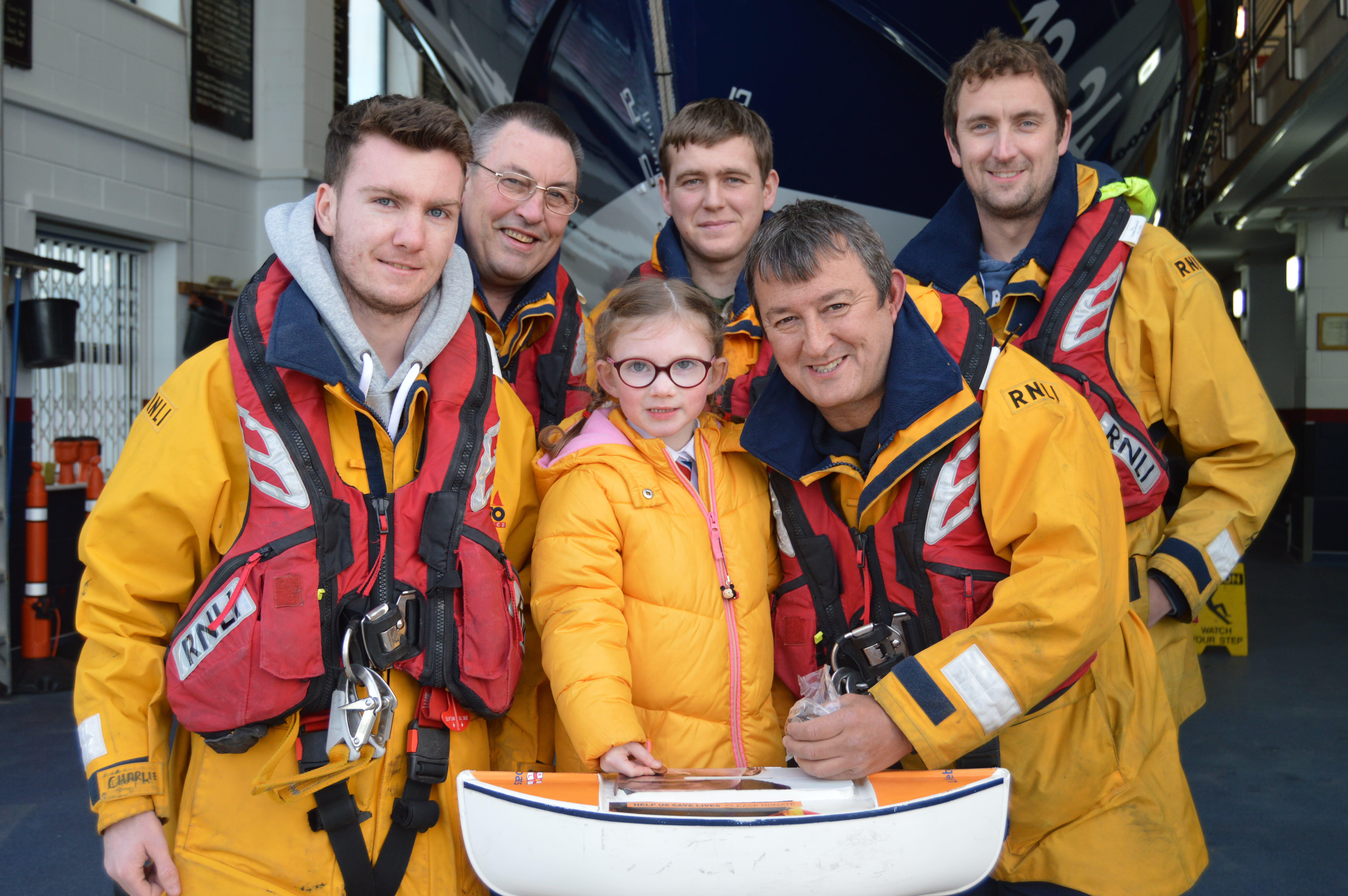 Darcey Payne, five, donating her pocket money and other monies raised (just over £180) to close the Rhyl RNLI Shannon appeal.