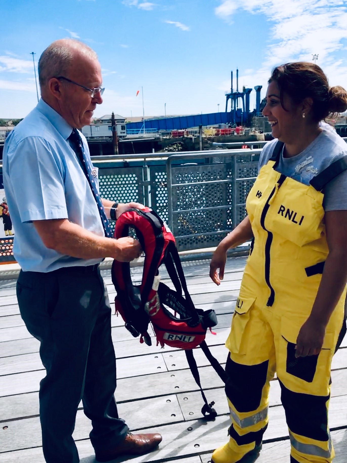 Roger Cohen, volunteer Lifeboat Operations Manager, assists Nusrat Ghani MP