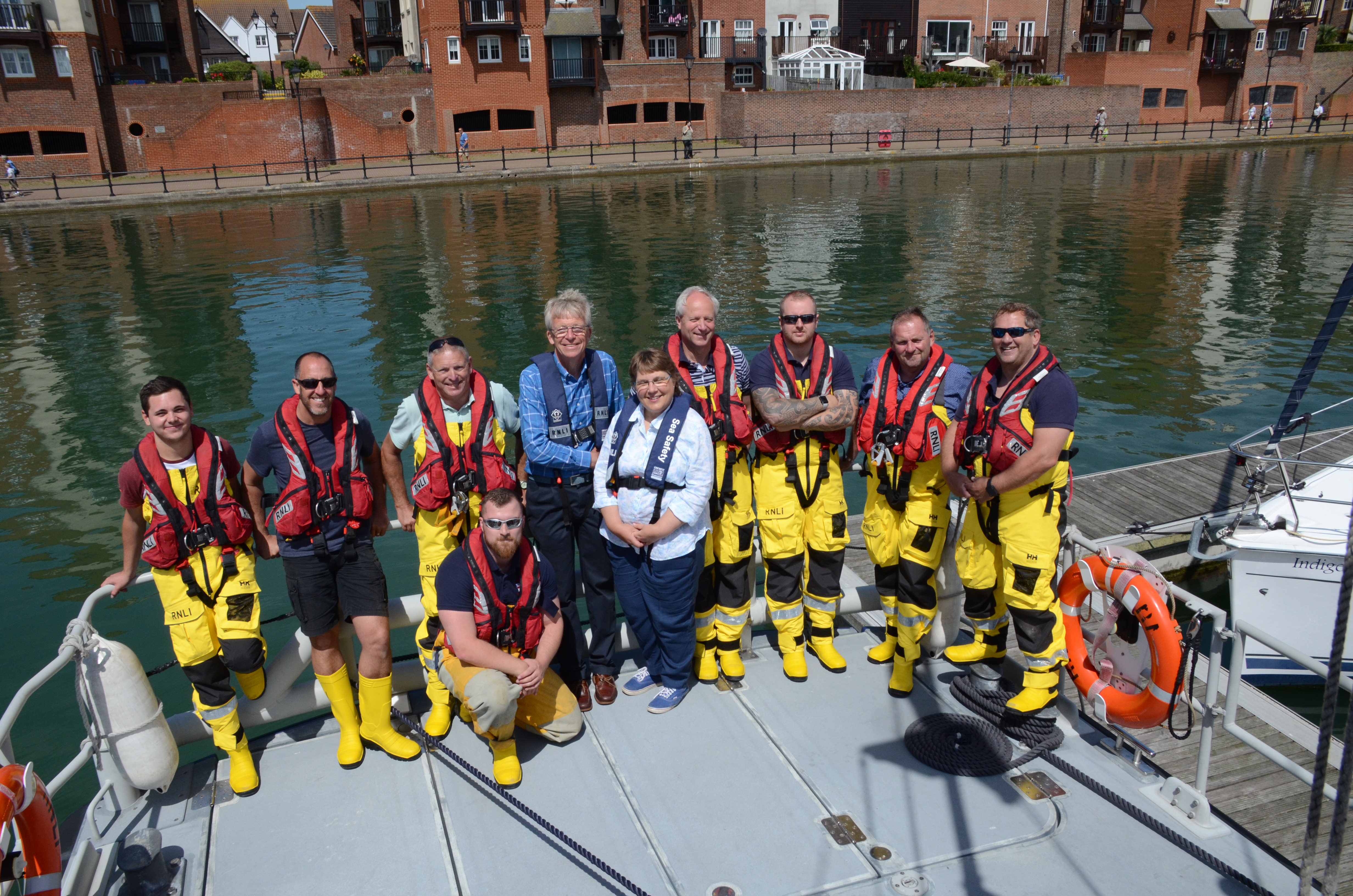 The High Sheriff of East Sussex with husband Tim pose with ALB crew