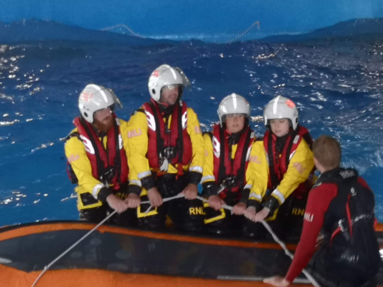 Ben, Dan, Kelsey and Lucy undergoing capsize training.