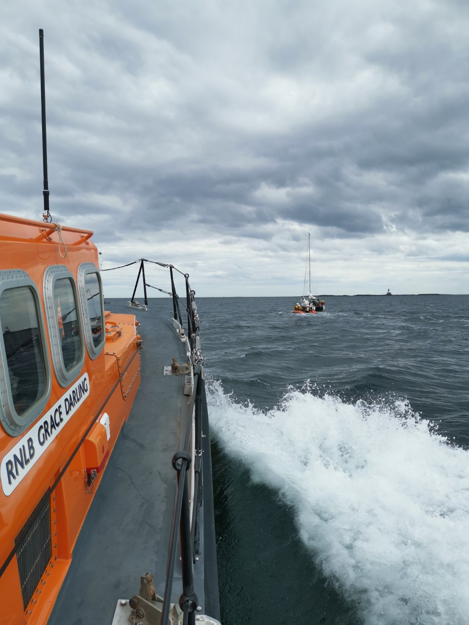 Lifeboats shadow yacht once free of grounding