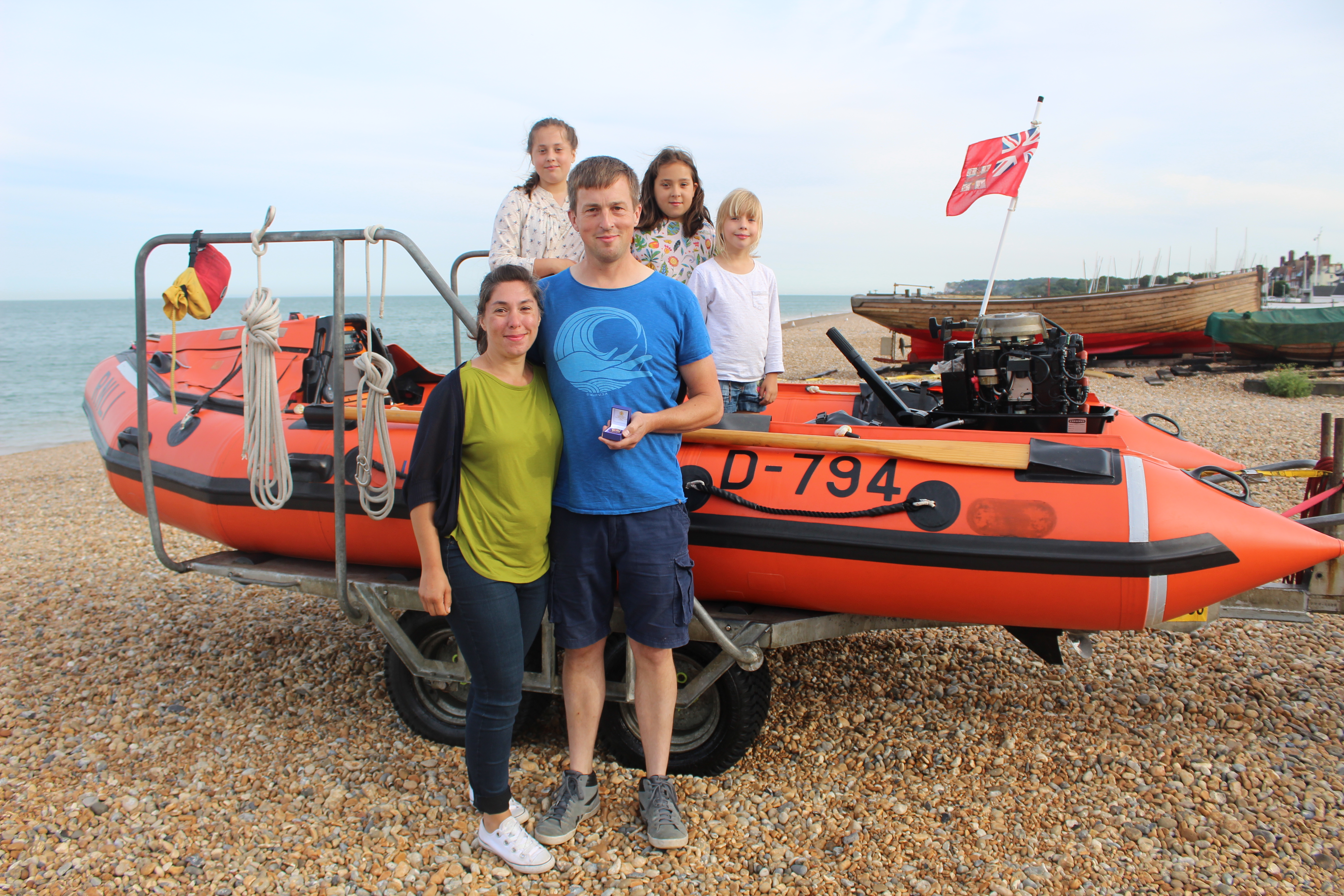 Volunteer Andrew Murray with his family after receiving his 20 Year Award.