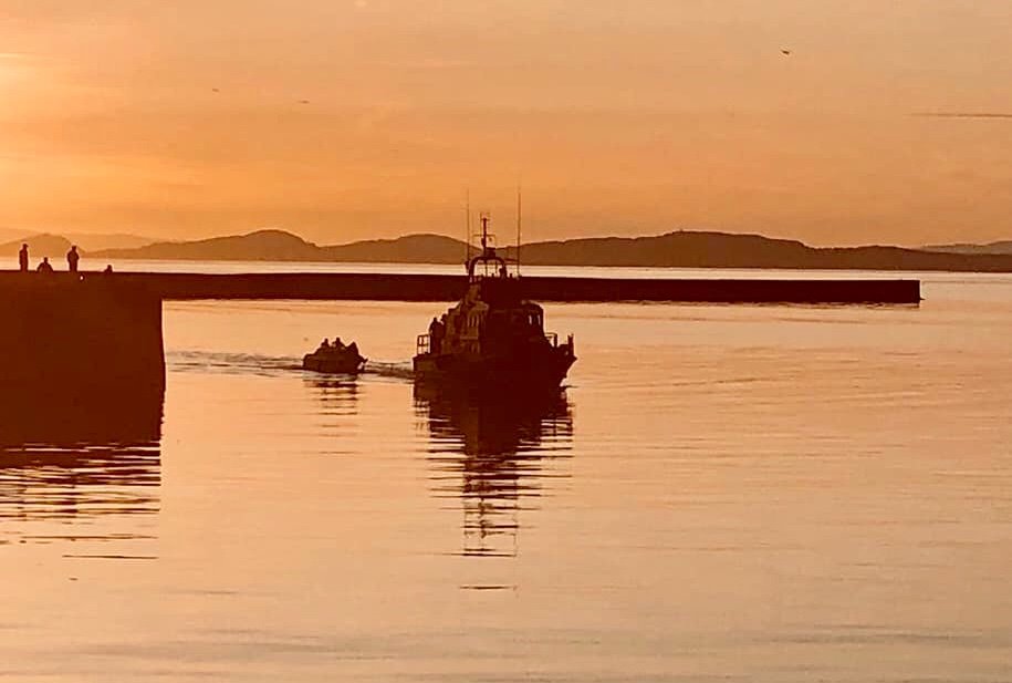 Troon RNLI Trent class all-weather lifeboat tows the casualty vessel into Ardrossan
