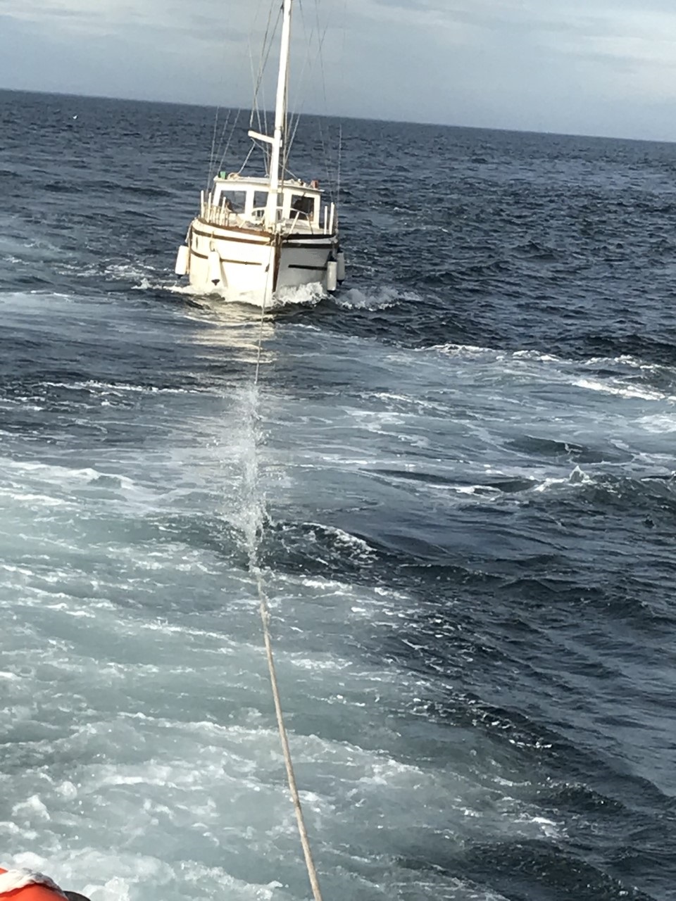 Yacht being towed