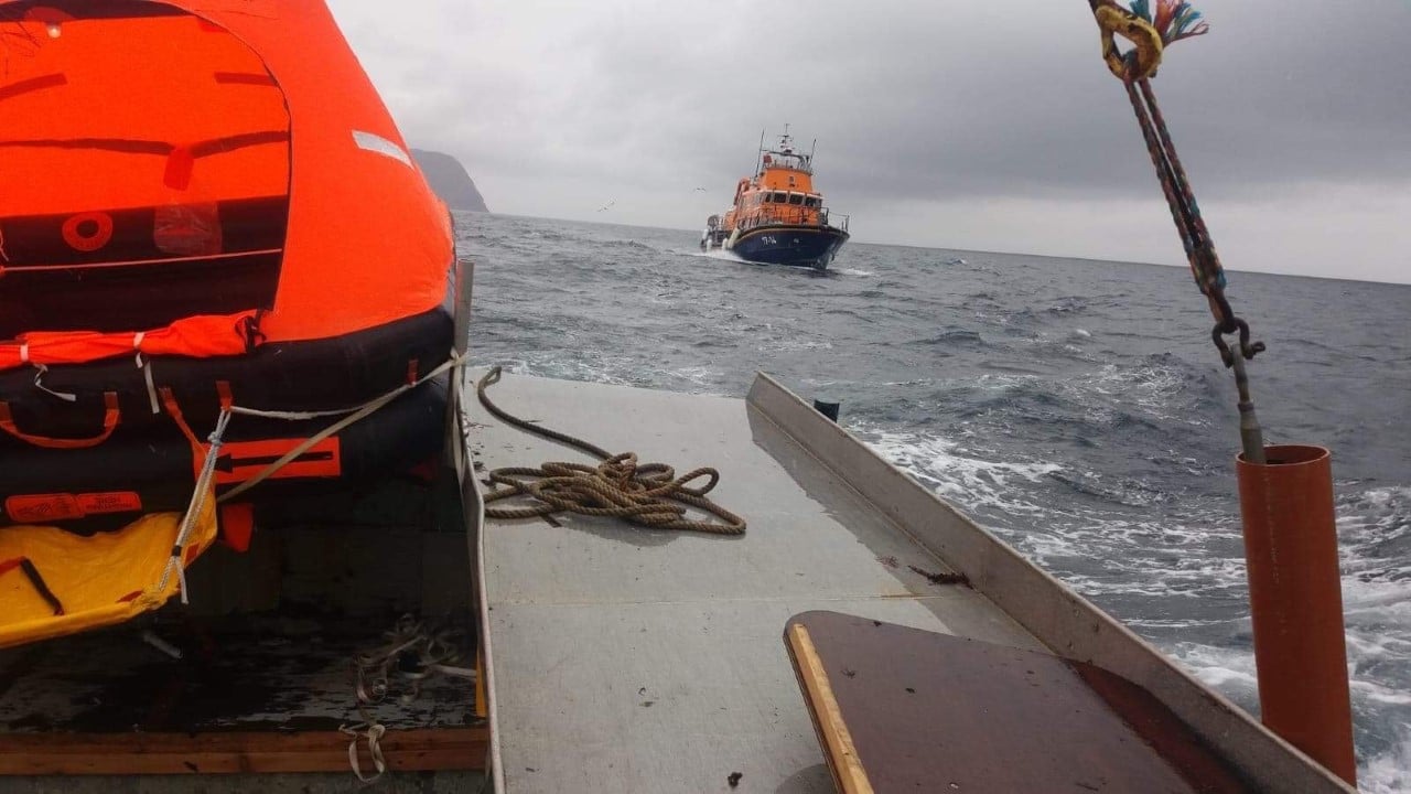 RNLI Aith's Charles Lidbury escorting Scottie's Pride to safety