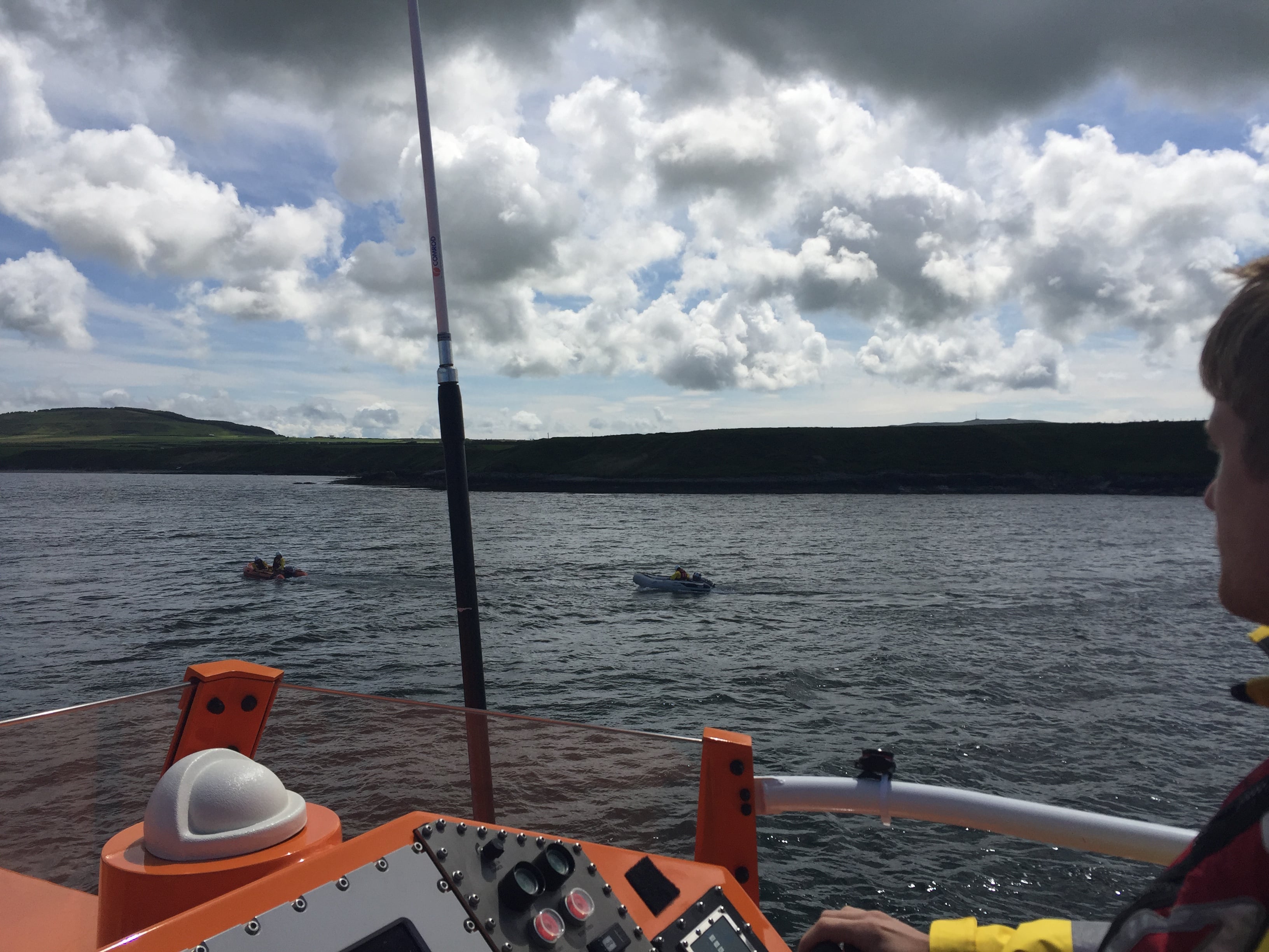 Dinghy being towed to Porthcolmon