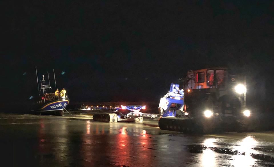 Dungeness RNLI Shannon being recovered on sand after returning to station photograph by volunteer shore crew Mark Rippingale