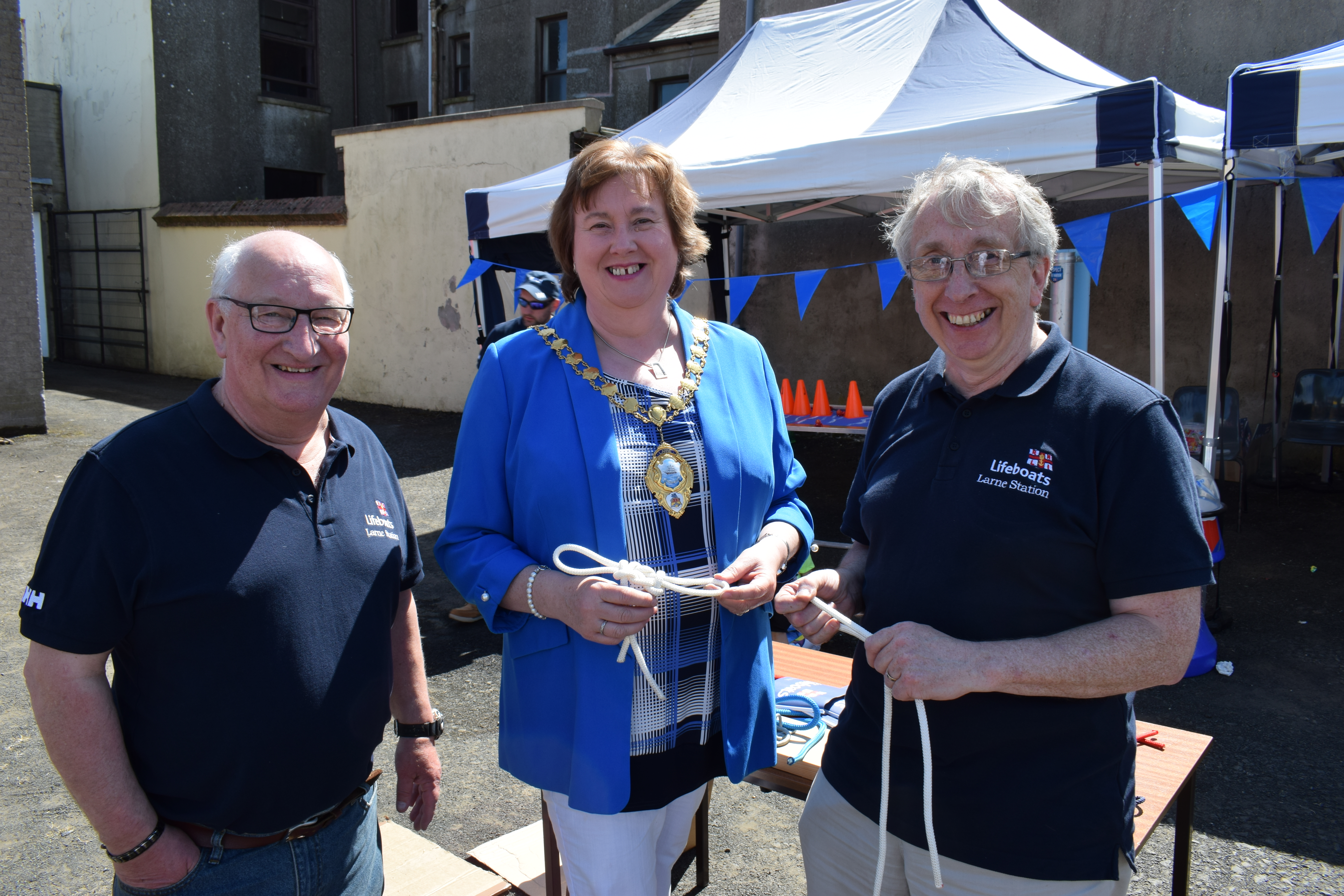 Mayor of Mid and East Antrim Cllr. Maureen Morrow learning some knot tying with crew member Stephen Craig and Lifeboat Operations Manager Allan Dorman