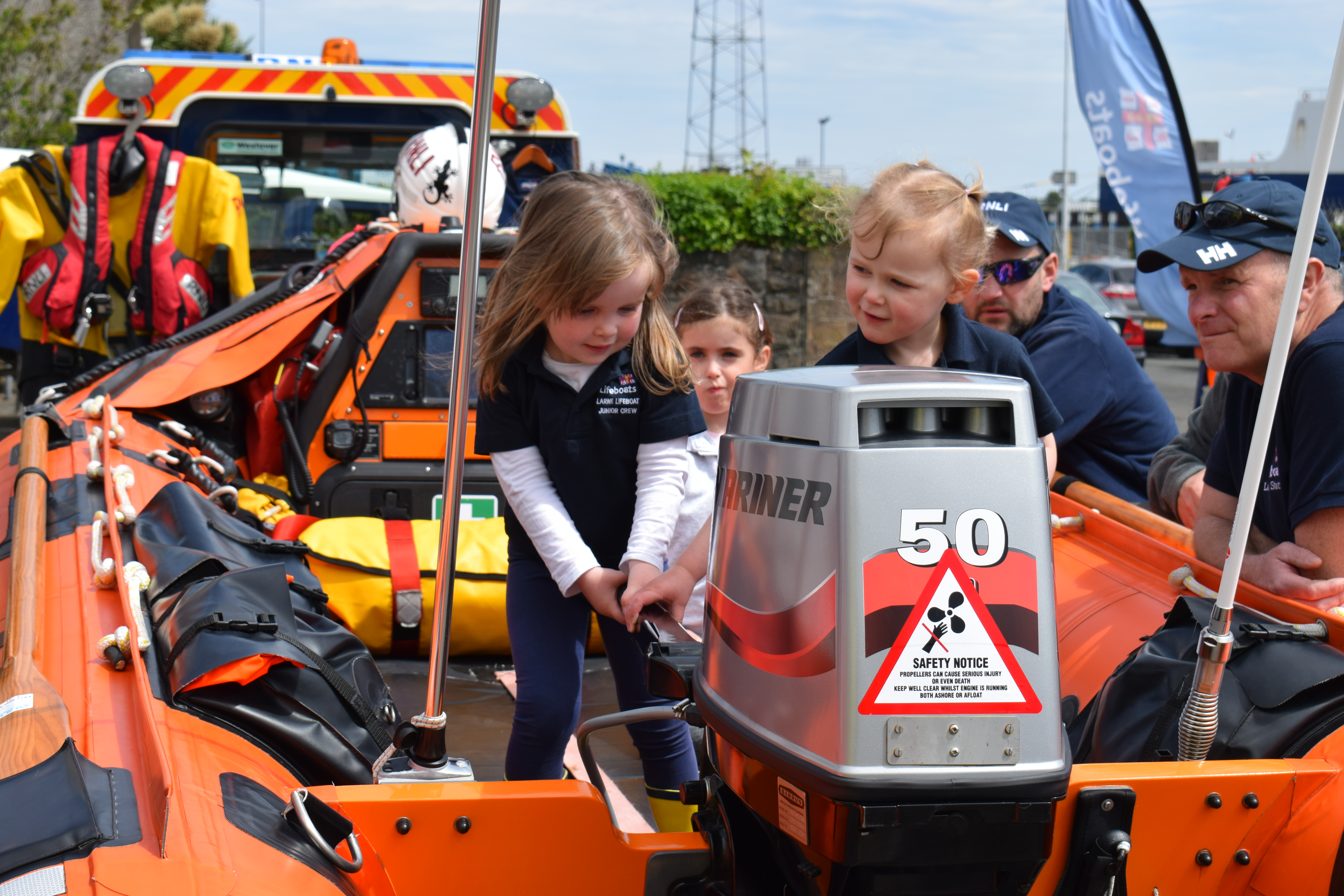 Junior crew Isla Kirkpatrick and Megan Ford-Hutchinson helming the inshore lifeboat
