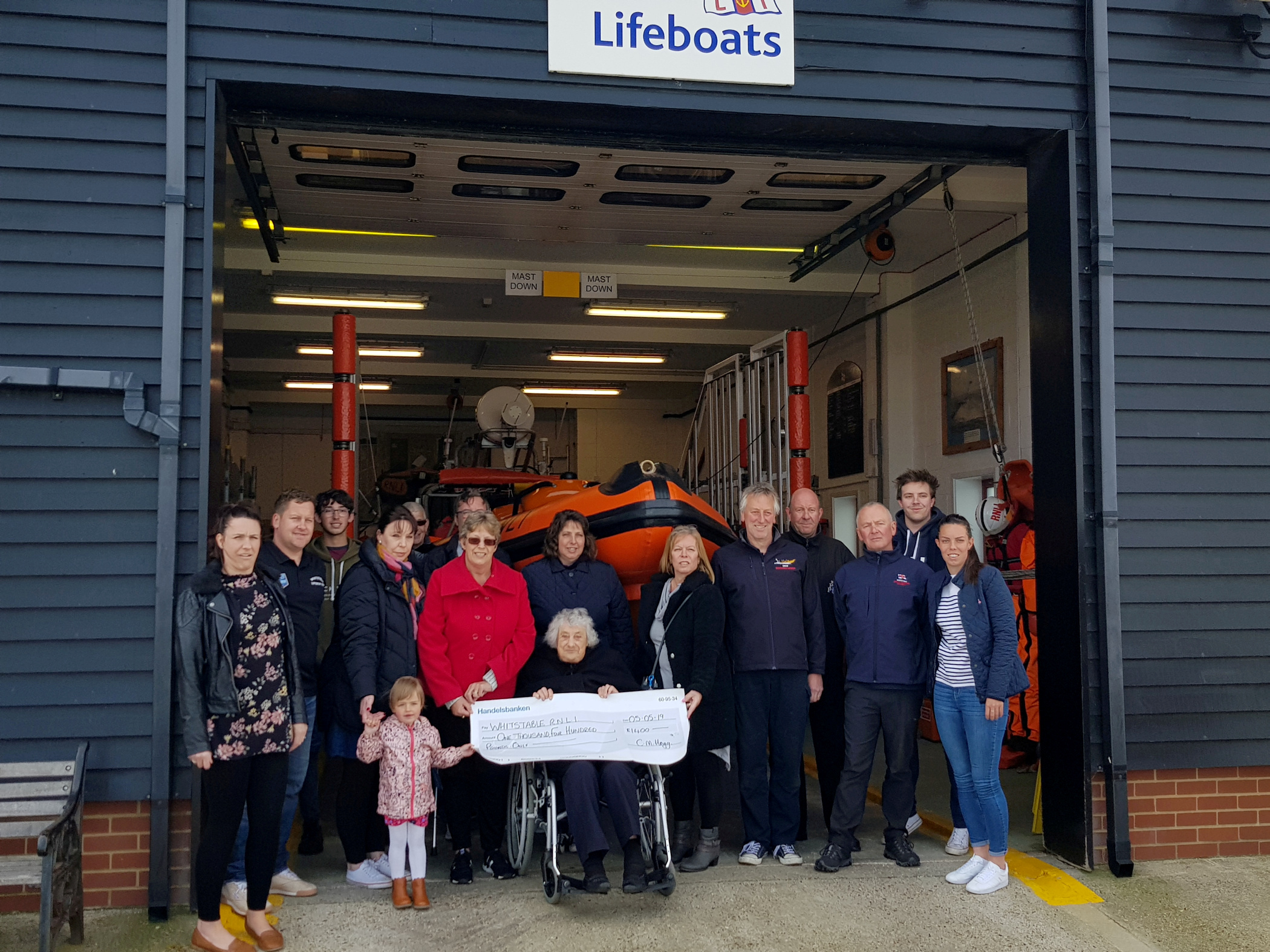 Claire Hogg and the family of the late David Cooper of Conyer present the cheque for £1400 to members of the Whitstable Lifeboat Station on Sunday. Picture: RNLI Whitstable.