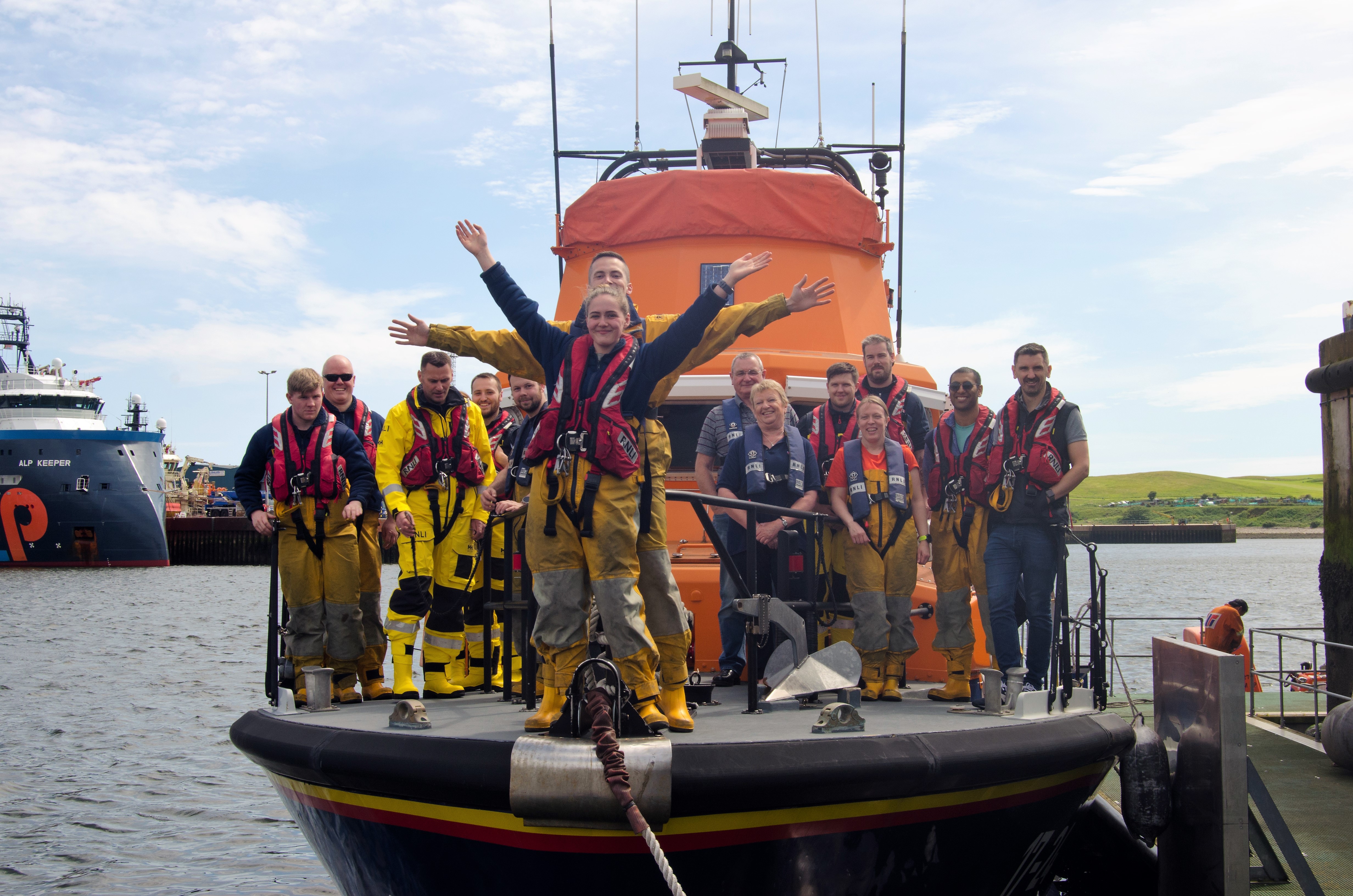 Newly engaged: Sam and Kirsty on the front of the lifeboat 