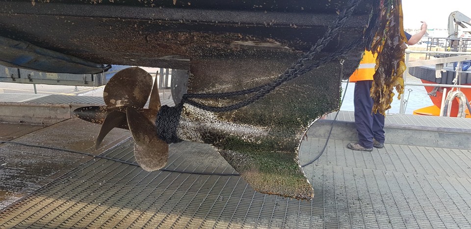 an image of a propellor with a rope wrapped tightly around it. 