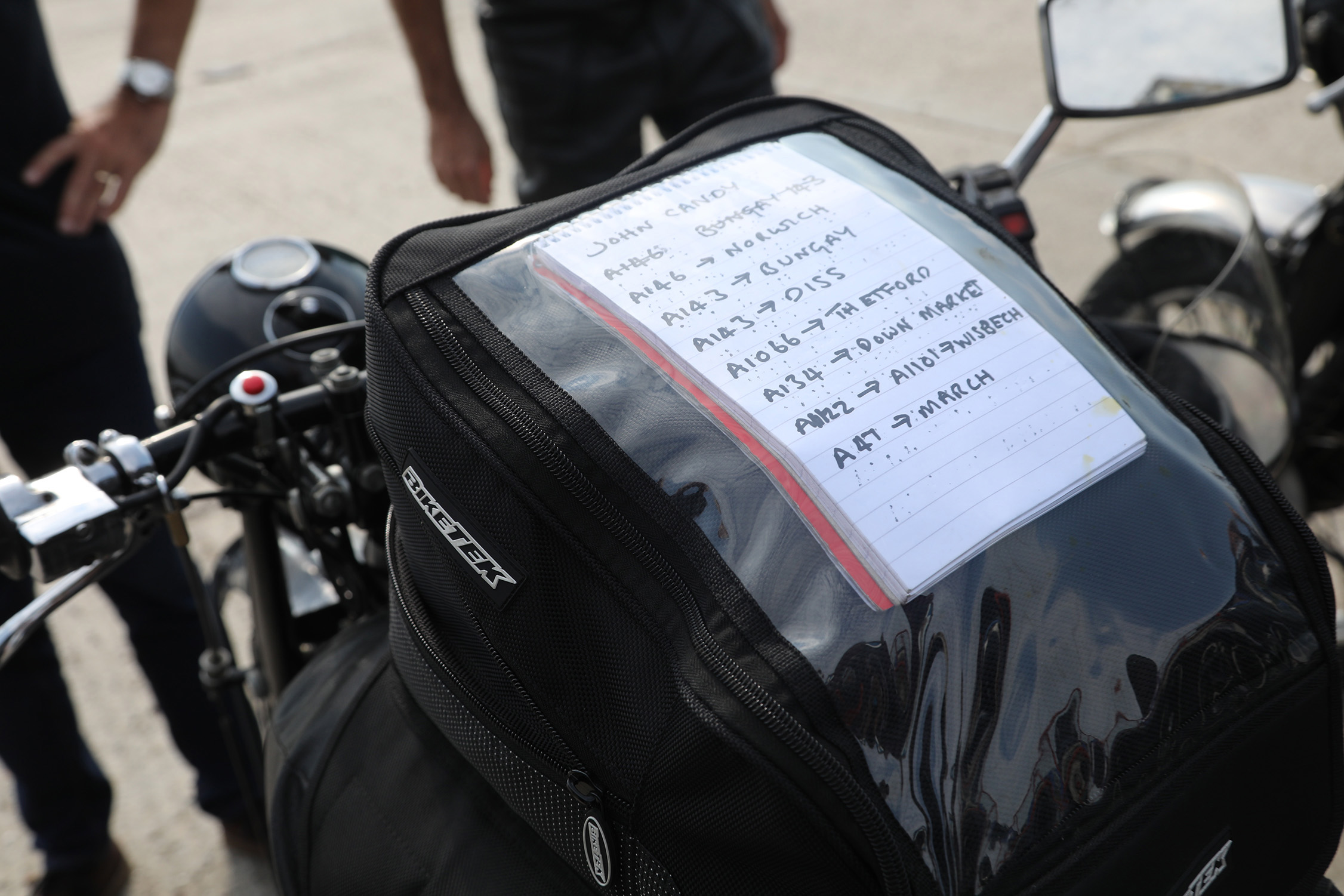 John Newson's itinerary written on paper and taped to his petrol tank