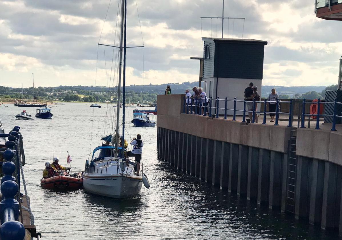Inshore lifeboat D class George Bearman II assisting 26' yacht into Exmouth Marina