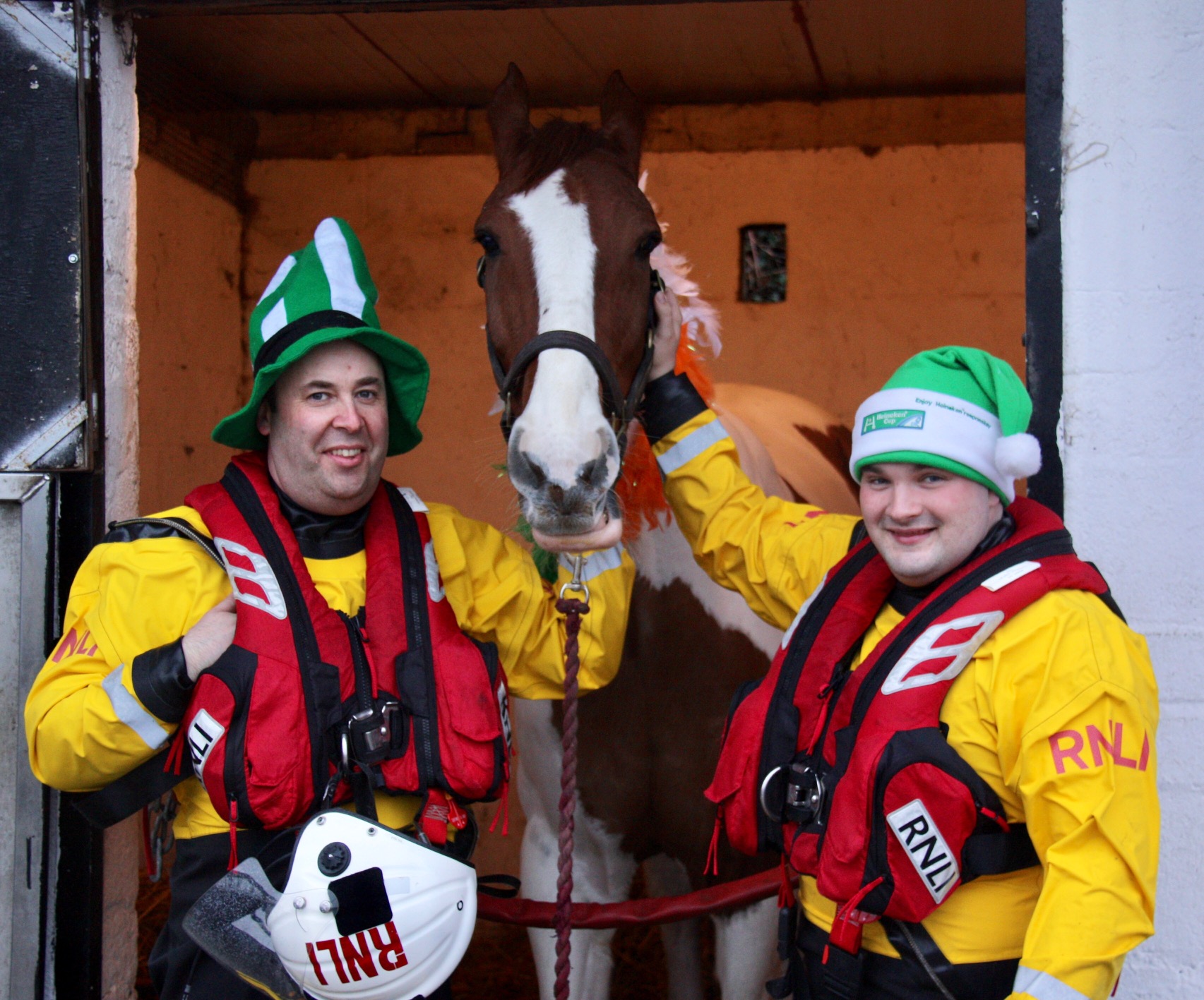 Two RNLI volunteers who rescued Paddy the horse visit him in his stable