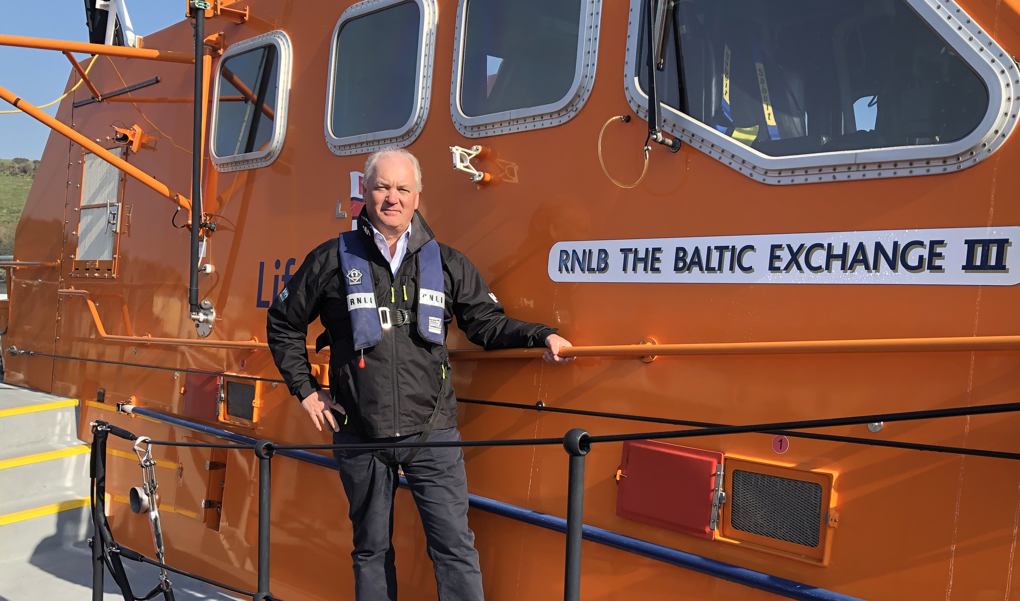 Mark Dowie stood on board Salcombe RNLI's Tamar class lifeboat