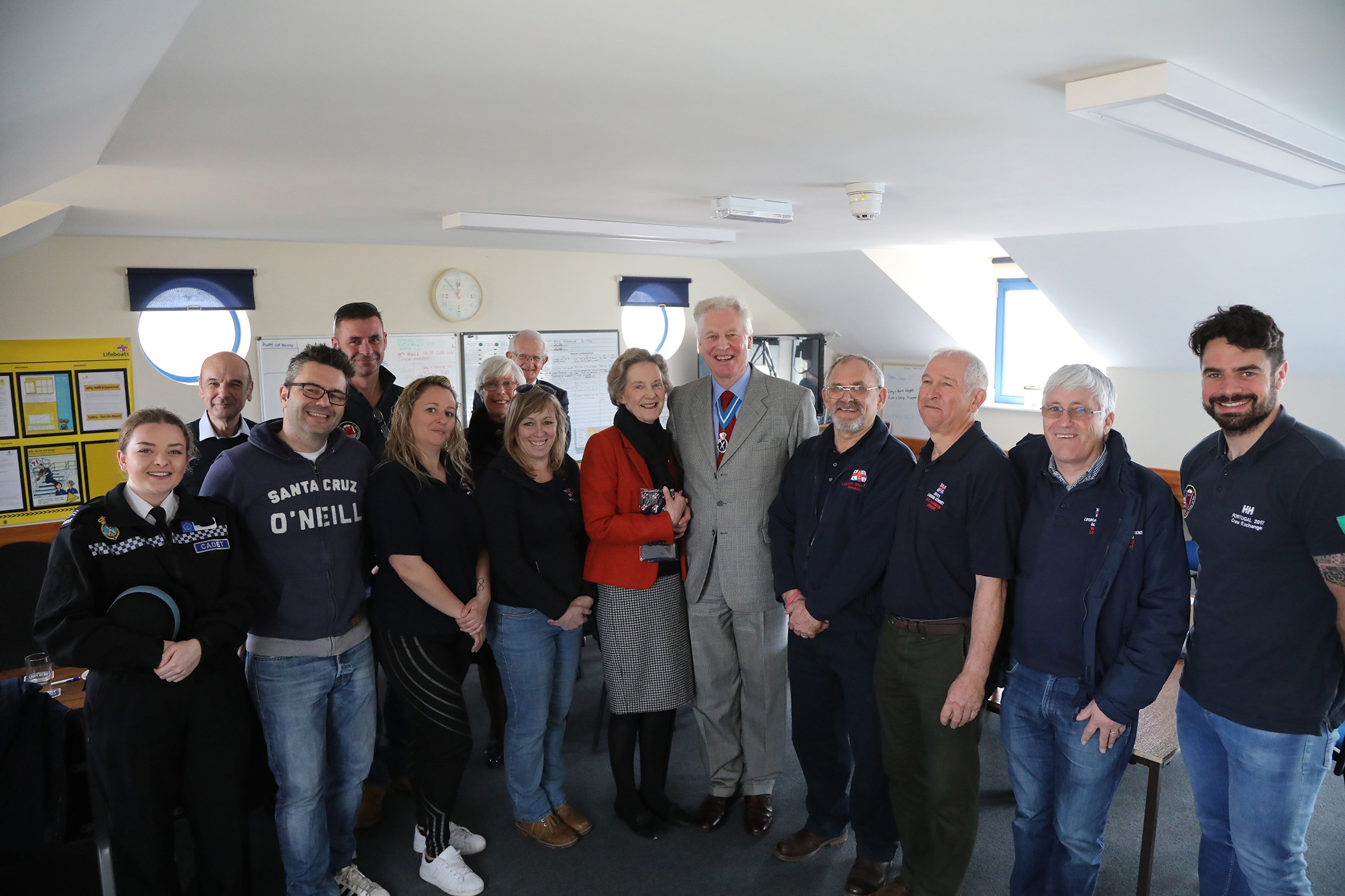 In the crew room at the station the High Sheriff is flanked by crew members and Lifeboat Operation Manager Tony Edwards