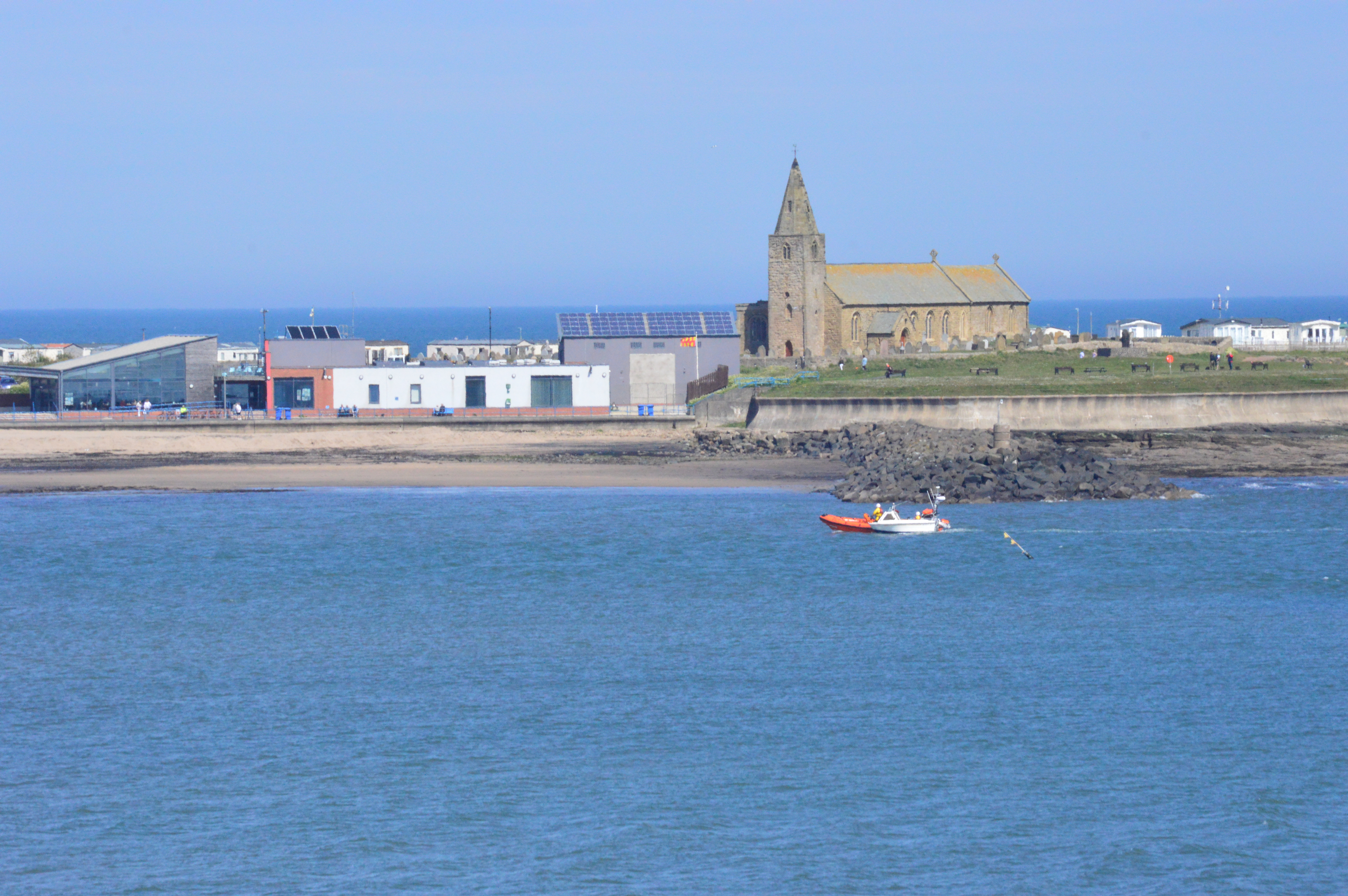 The lifeboat towing the casualty vessel into the bay