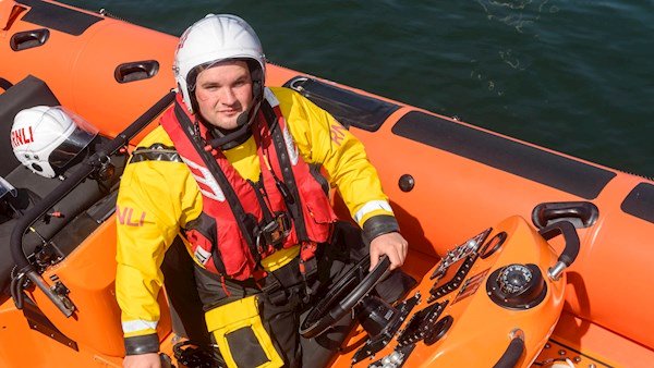 Jonathan Connor at the helm of Miss Sally Anne Baggy II