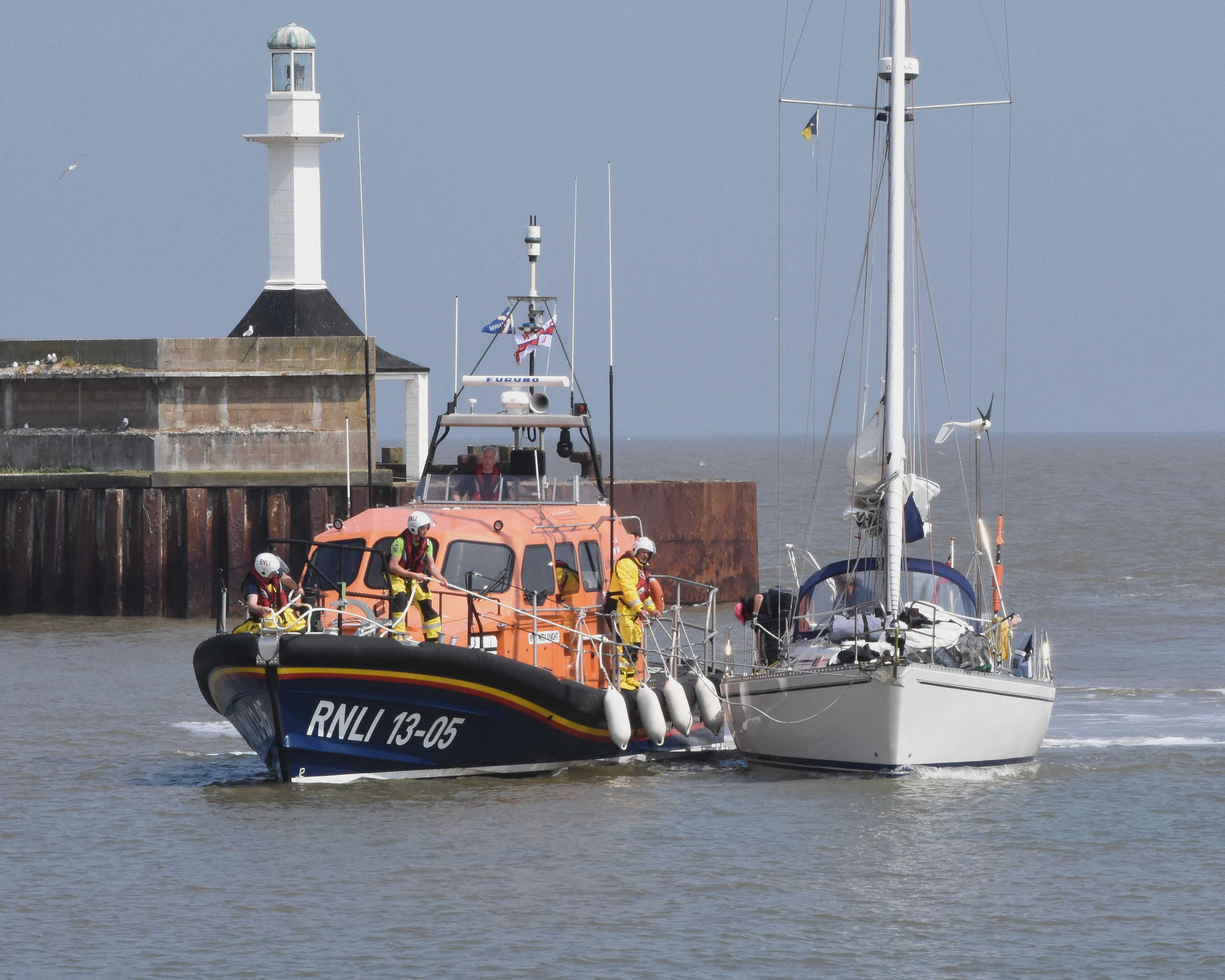 Lowestoft RNLI lifeboat tows the yacht with engine failure in port