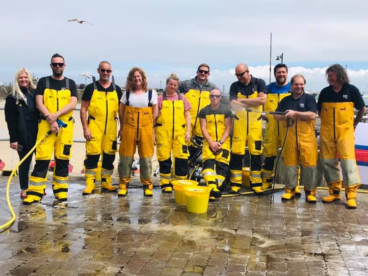 St Ives RNLI crew pictured in their yellow kit