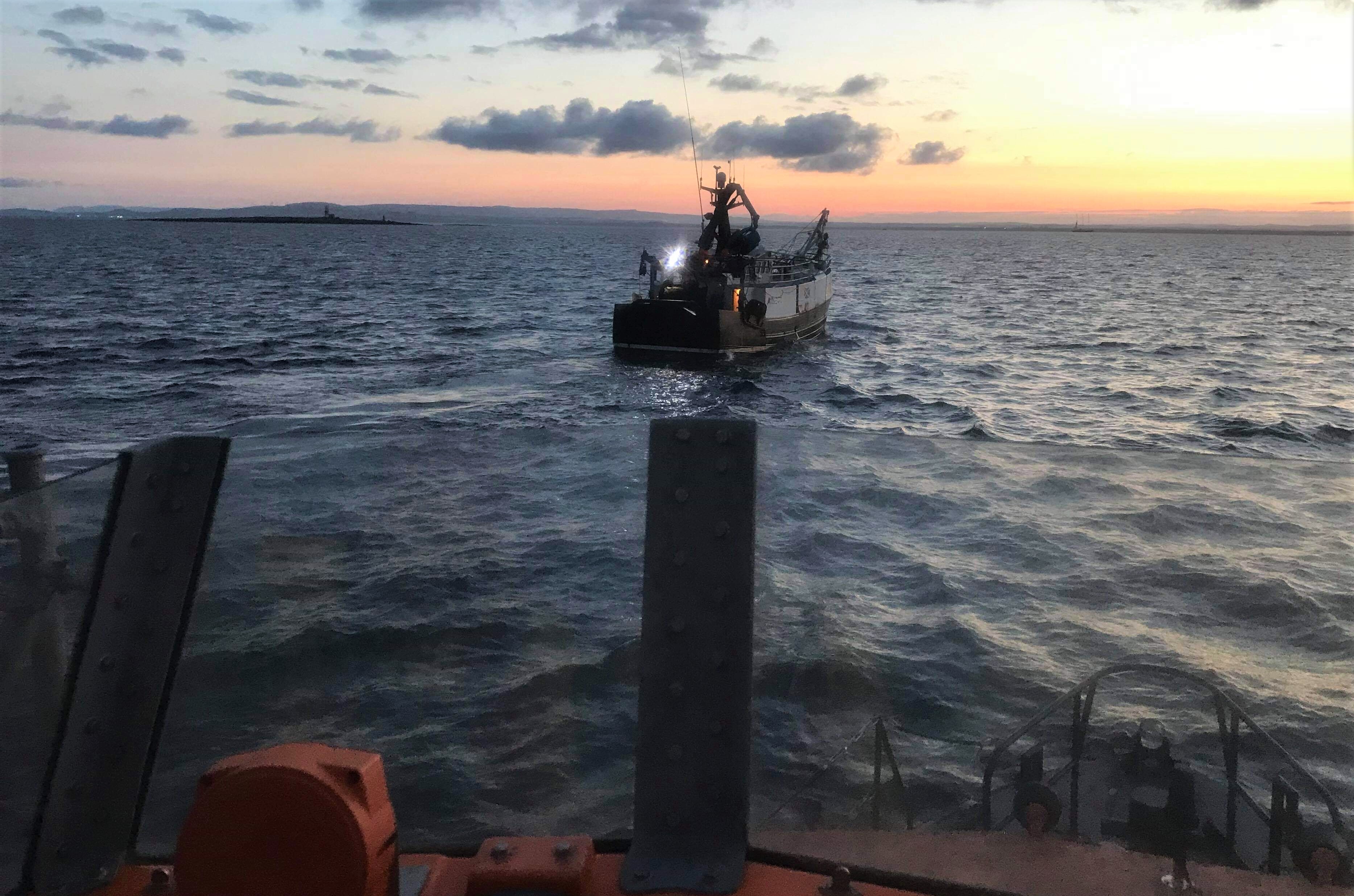 Troon Trent class all-weather lifeboat 'RNLB Jim Moffat' escorting the fishing vessel back to Troon