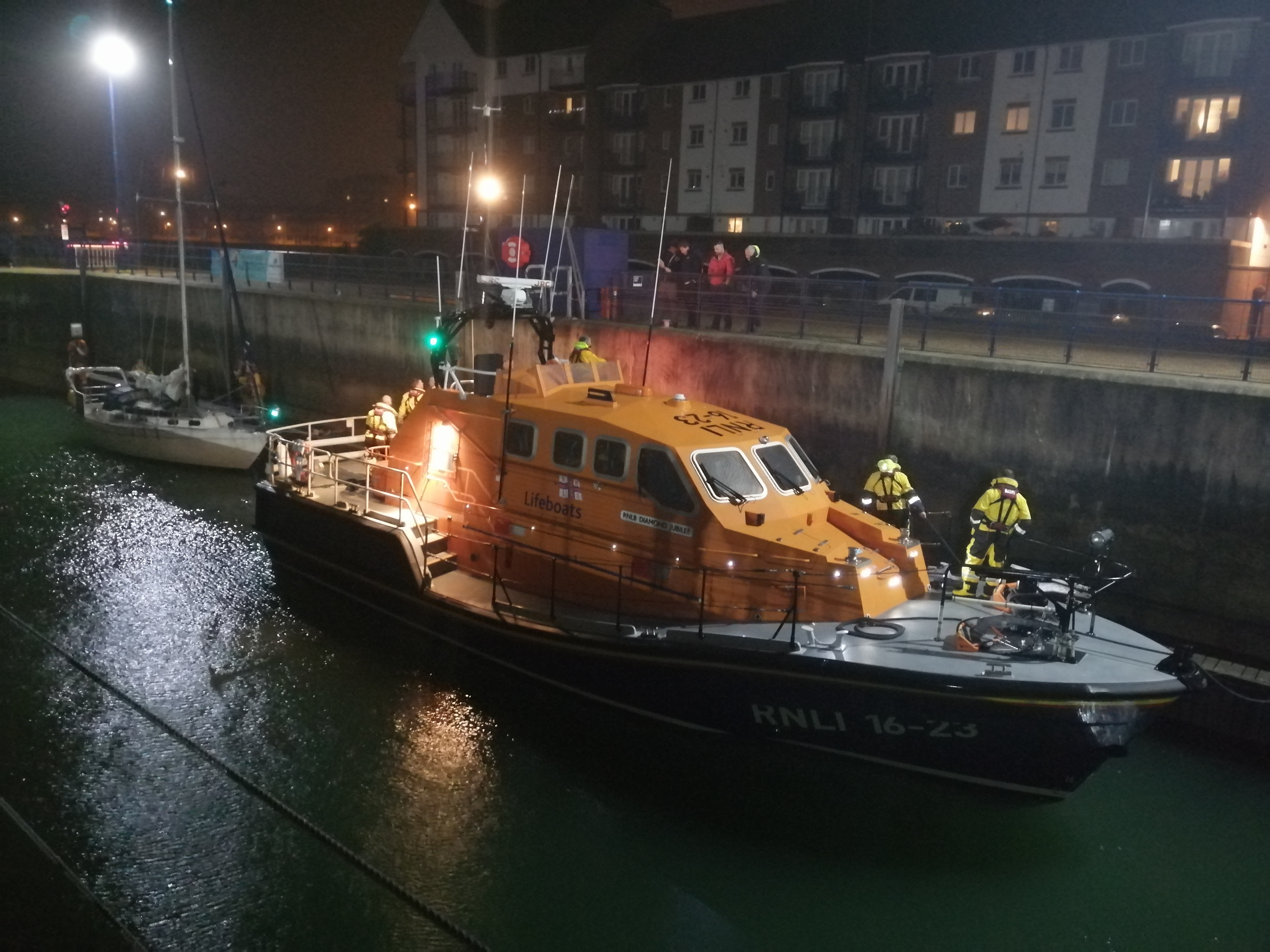 Rescued vessel being towed into harbour