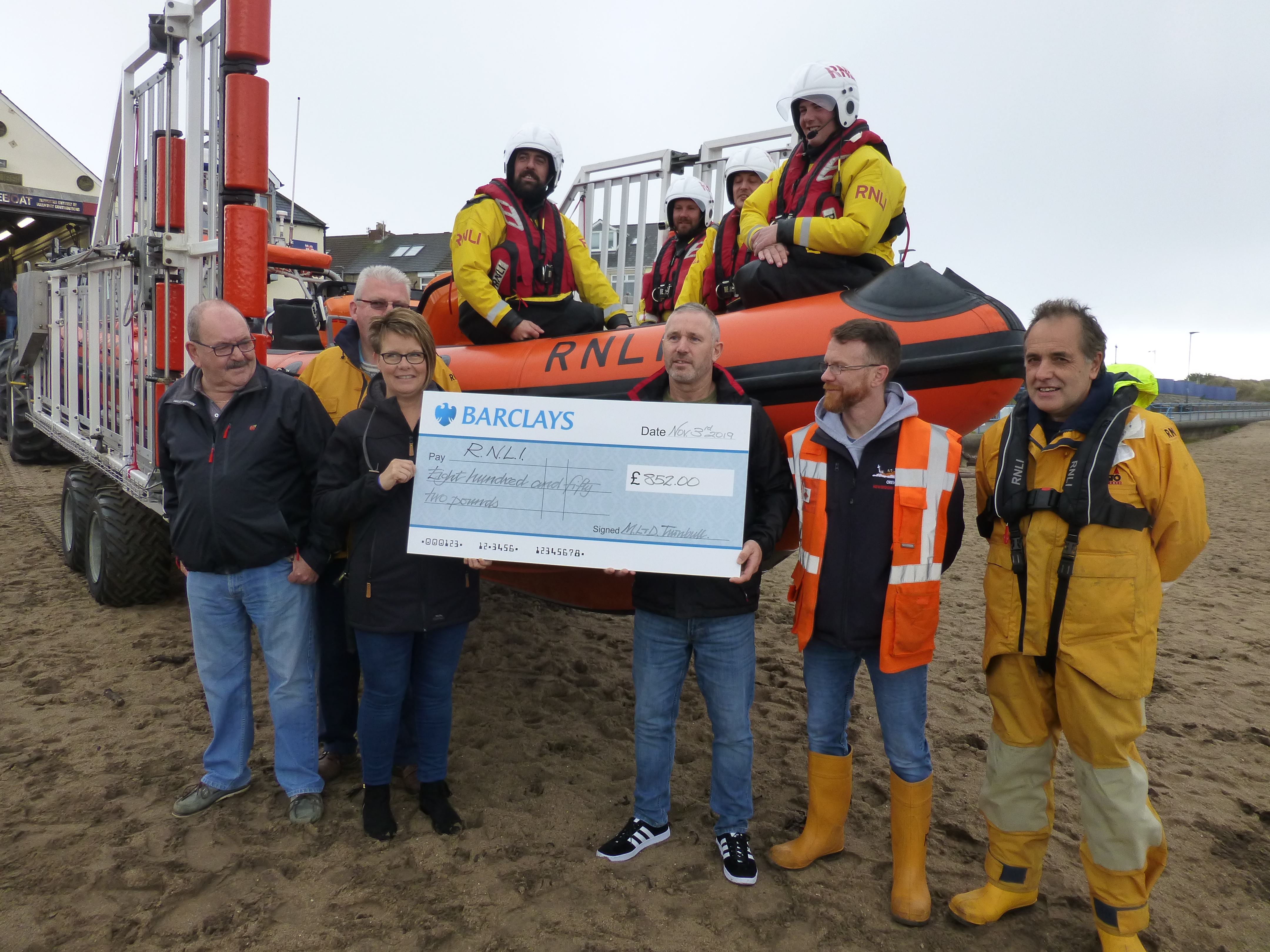 Debbie and Marc presnt the cheque