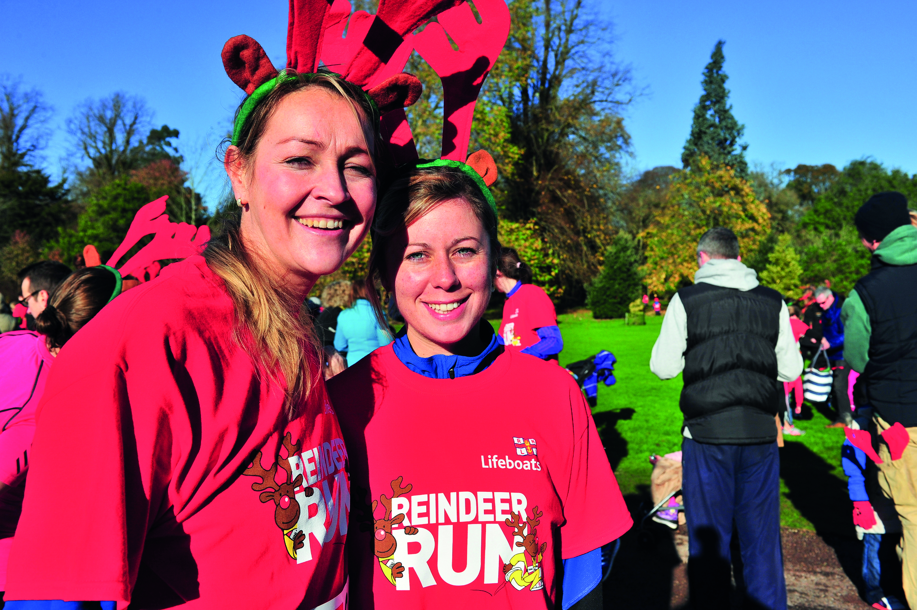 Photo of two past participants in an RNLI Reindeer Run.