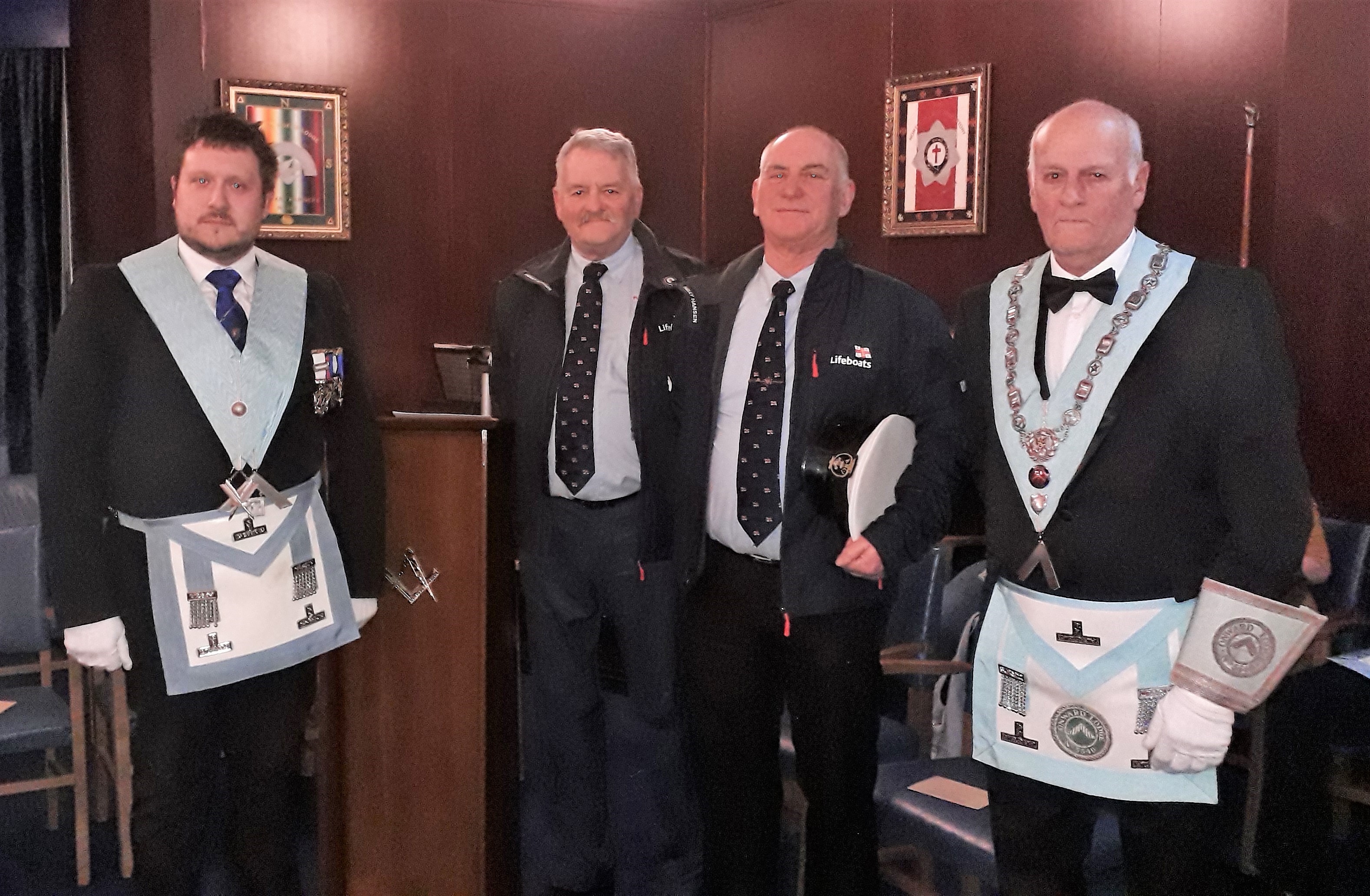 Operations Manager Captain Dave Eccles and Coxswain Tony Cowell with Onward Lodge representatives Adam Simpson and Barrie Whiteside