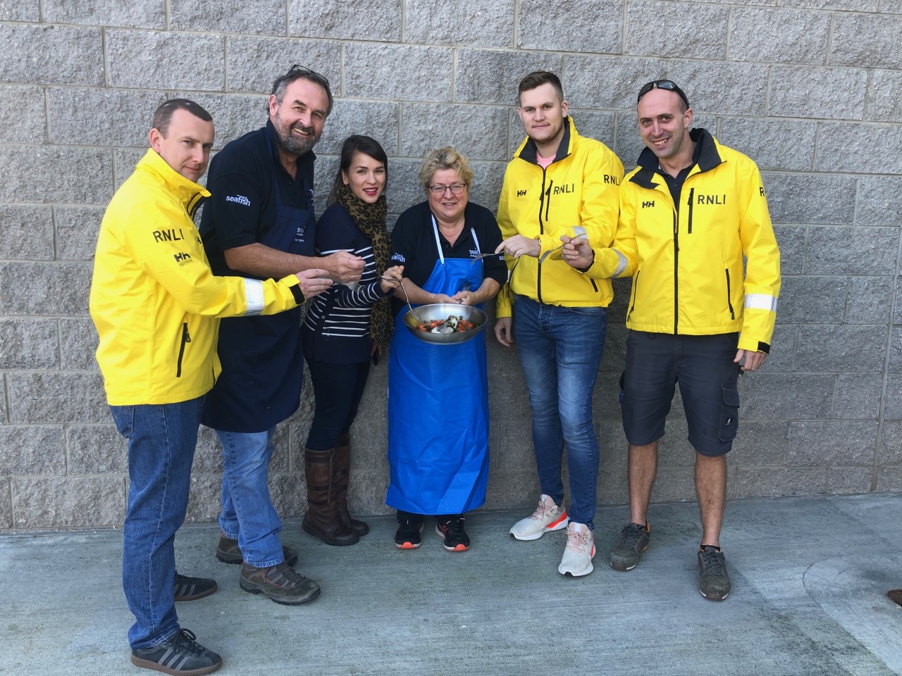 Some of Peterhead's crew dig into seafood tempura with celebrity chef Rachel Khoo